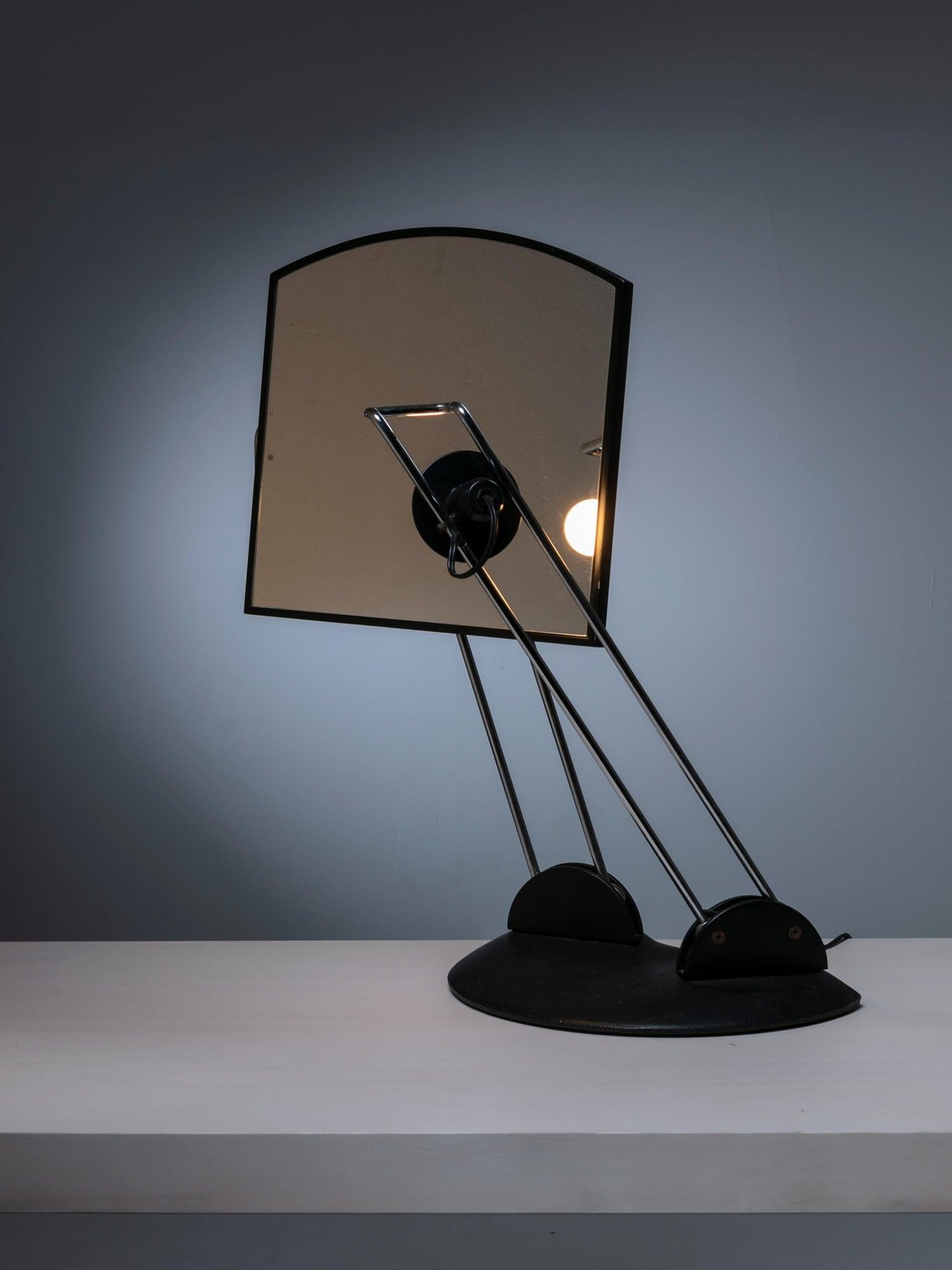 Rare adjustable table mirror with lamp.
Both mirror and lamps arms move separately and are connected on a cast iron base.
Minimal research on the table mirror theme.
Piece can also be used on a vanity or as a table lamp, reflecting and diffusing