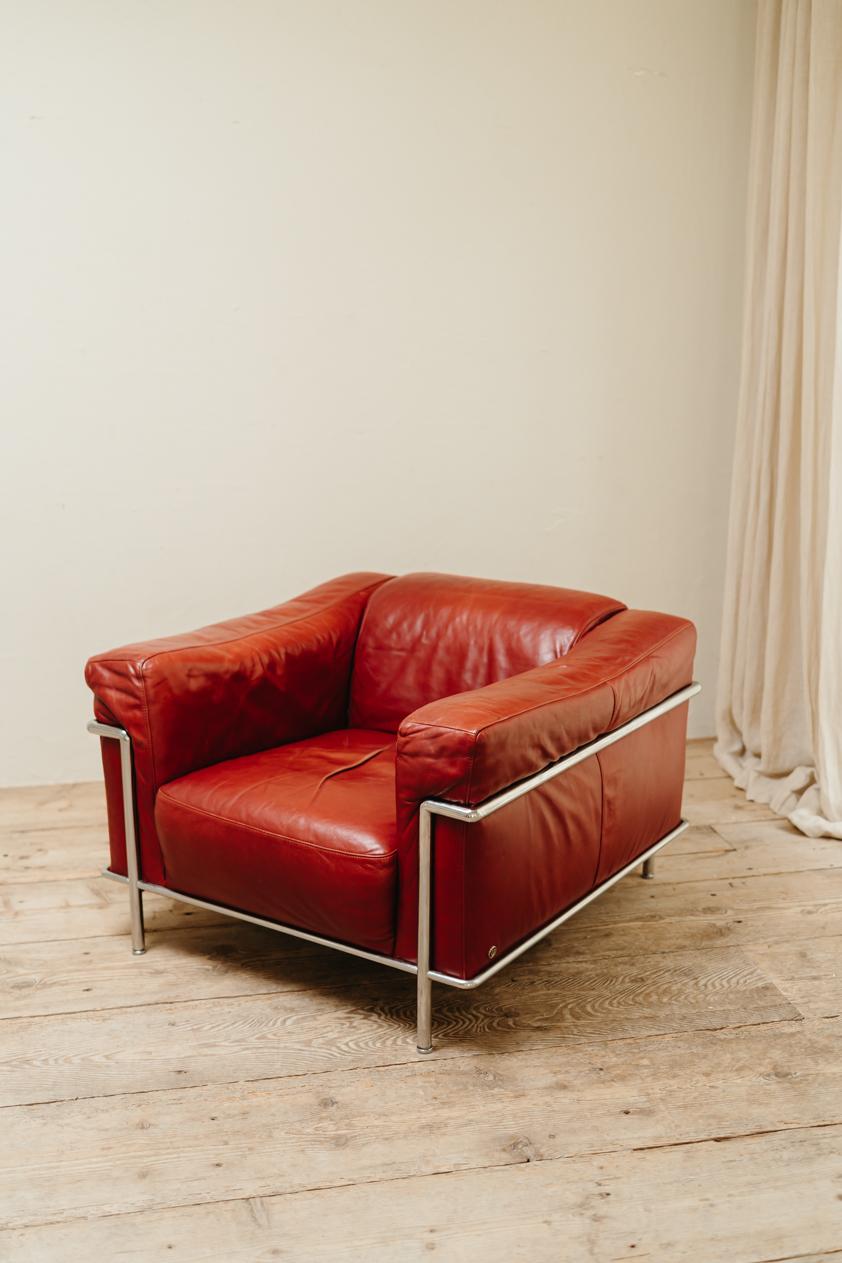 Leather Italian chrome and red leather lounge chair, Natuzzi