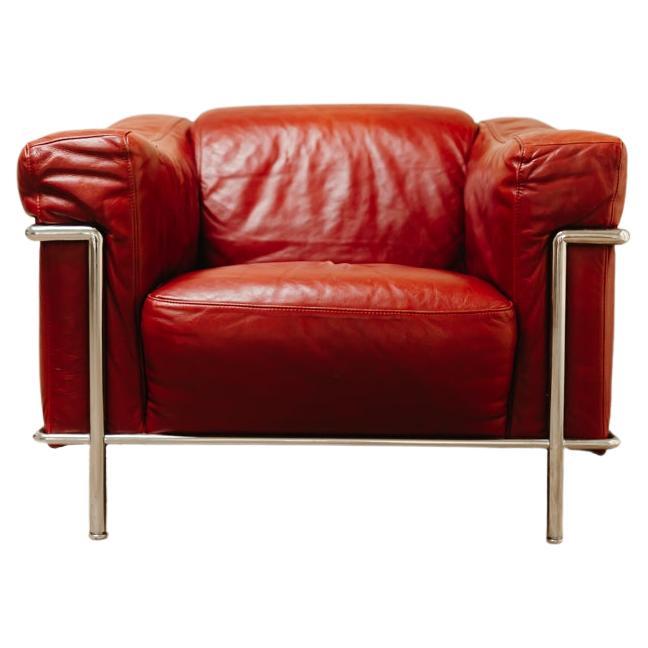 Italian chrome and red leather lounge chair, Natuzzi