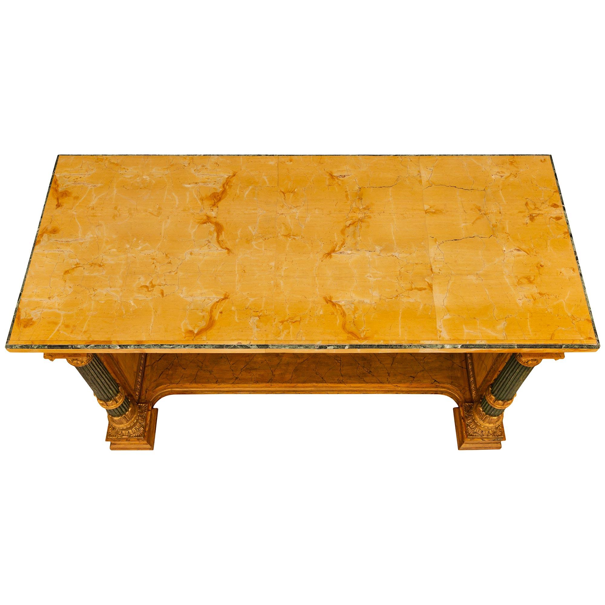 A high quality and beautiful Italian 19th century Neo-Classical st. Sienna, Giallo Antico, faux painted marble, patinated wood and Giltwood library/center table. This unique library table is raised by four column like legs with square mottled edge