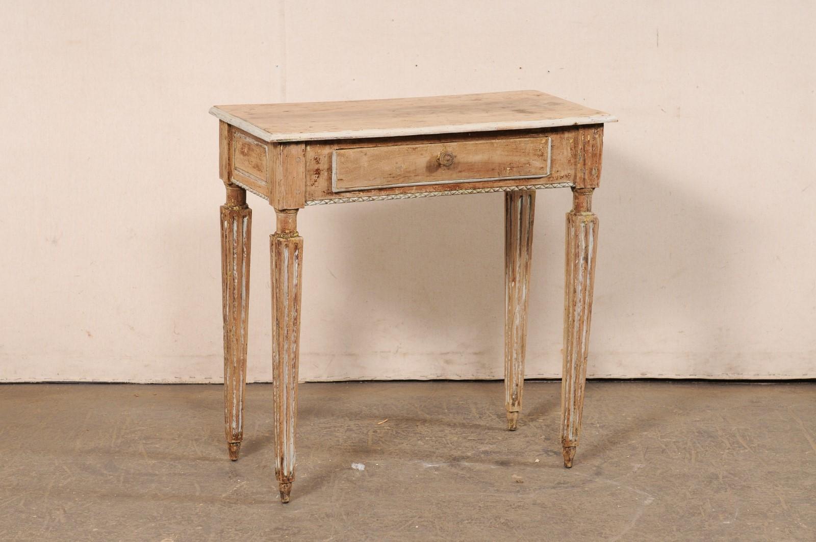 An Italian smaller-sized, carved-wood console table, with single drawer, from the 19th century. This antique table from Italy has a new rectangular-shaped top with beveled edges, which overhangs the apron below that houses a single drawer along one