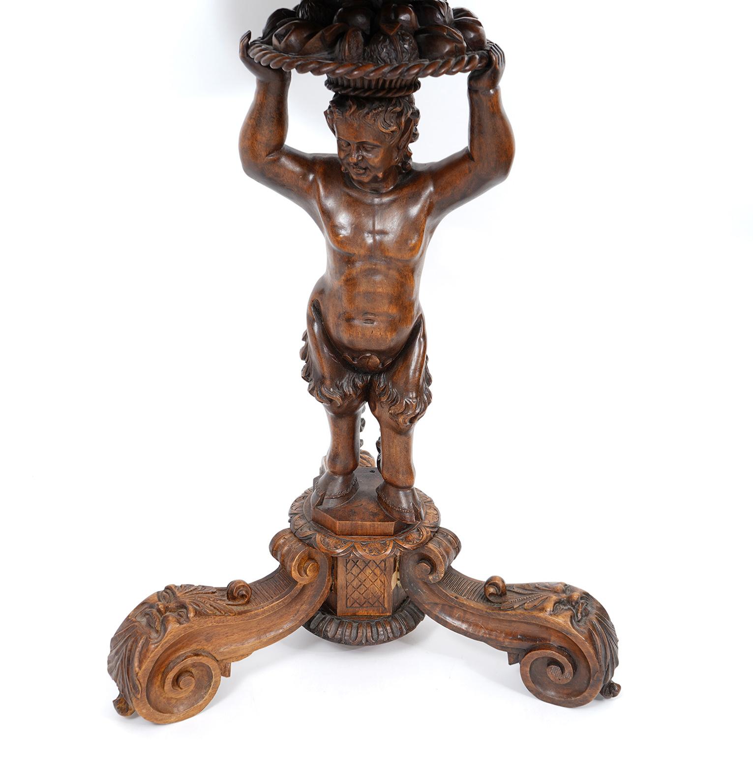 Baroque Italian 19th C. Richly Carved Walnut Round Table Supported by a Young Satyr