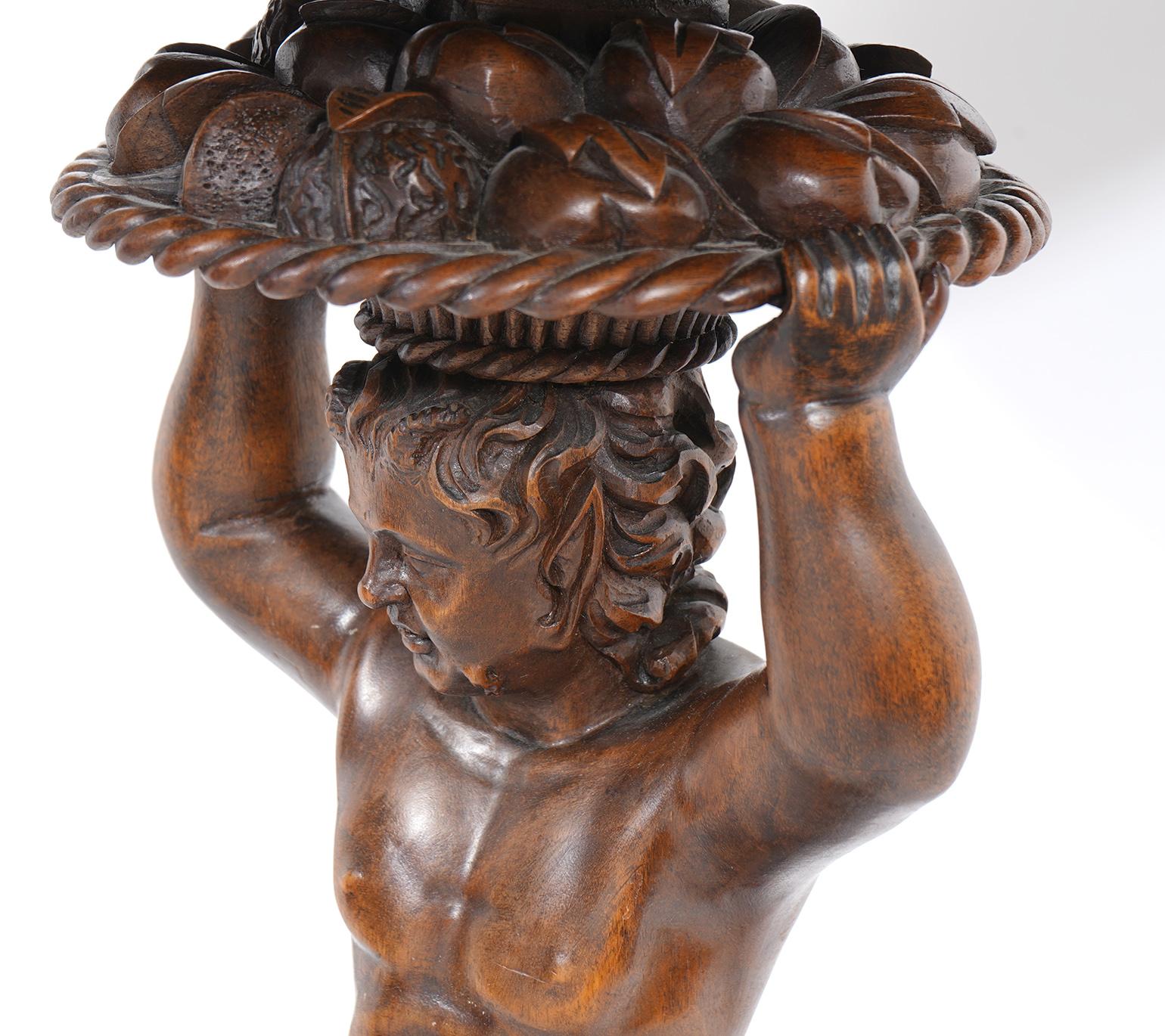 Italian 19th C. Richly Carved Walnut Round Table Supported by a Young Satyr In Good Condition In Ft. Lauderdale, FL