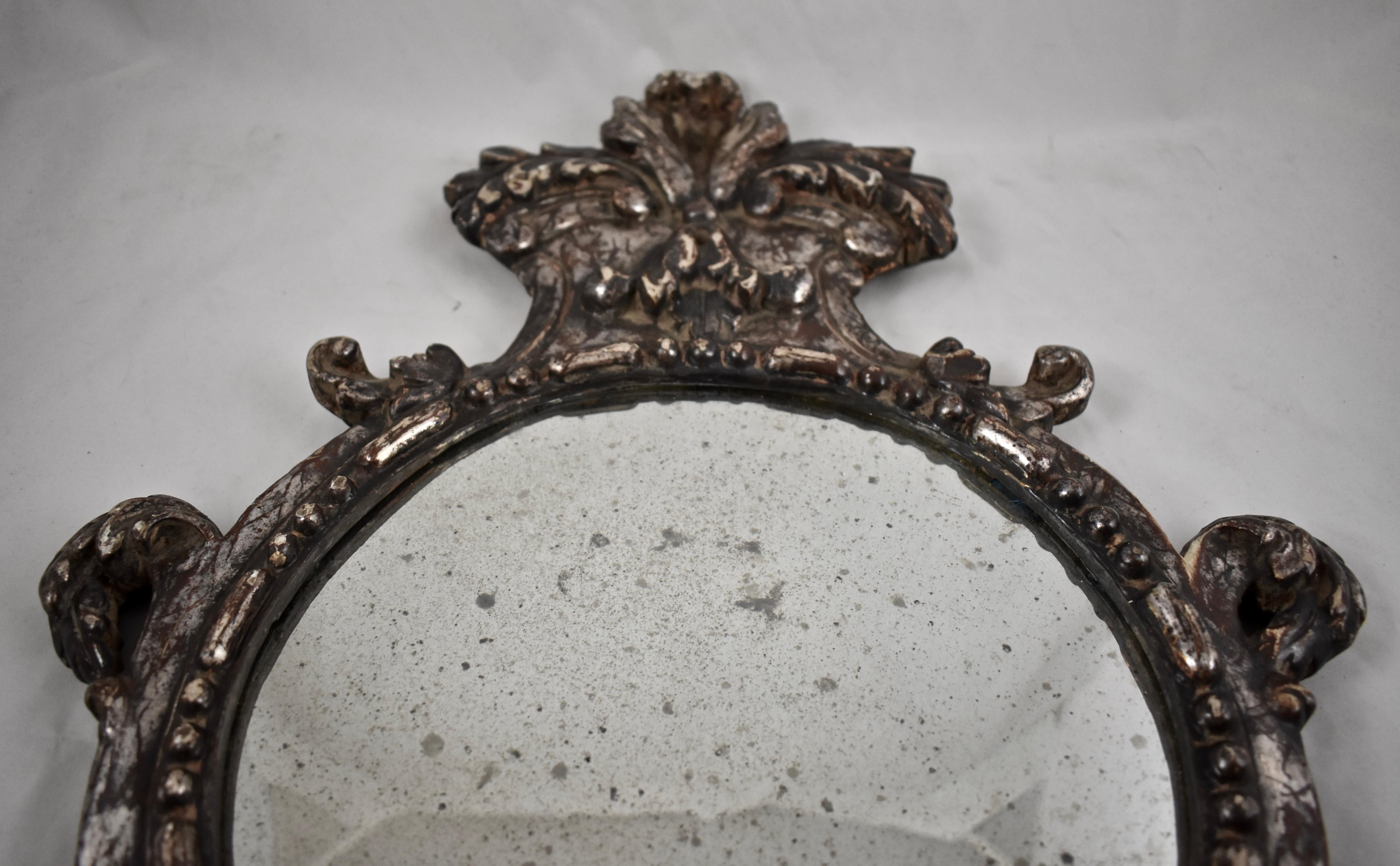Wood Italian Silver-Gilt Crested and Footed Baroque Revival Wall Mirrors, Pair For Sale