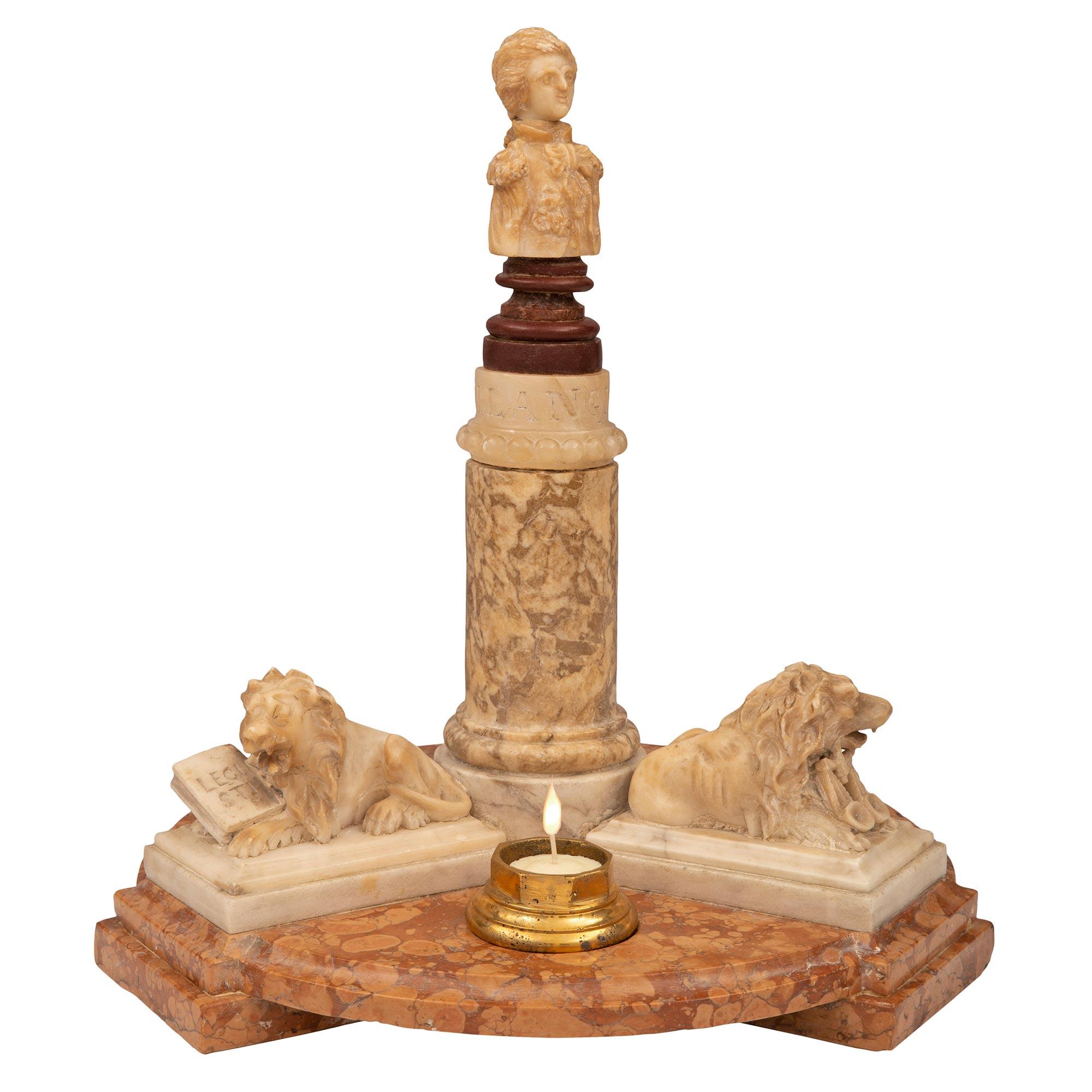 An exquisite Italian mid 19th century alabaster, porphyry and marble centerpiece. The centerpiece is raised by a round moulded Breccia de Guillestre marble base with three rectangular mottled supports below. On top of the base are three rectangular