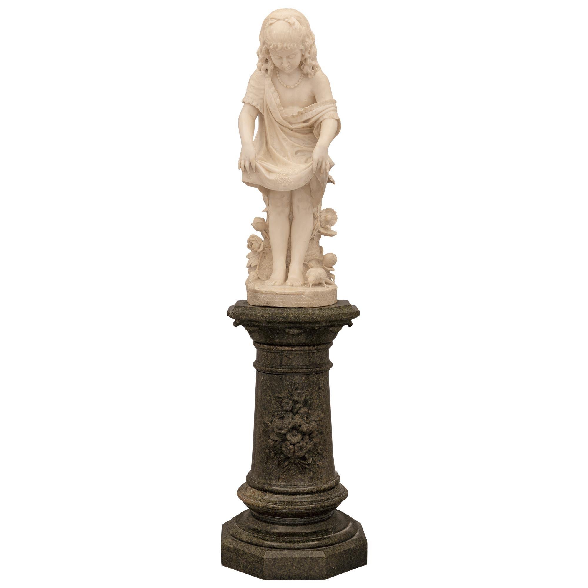 A stunning and extremely high quality Italian 19th century Alabaster statue and marble pedestal. The statue is raised on a striking Italian 19th century Louis XVI st. marble pedestal displaying an octagonal base below a circular mottled border. The