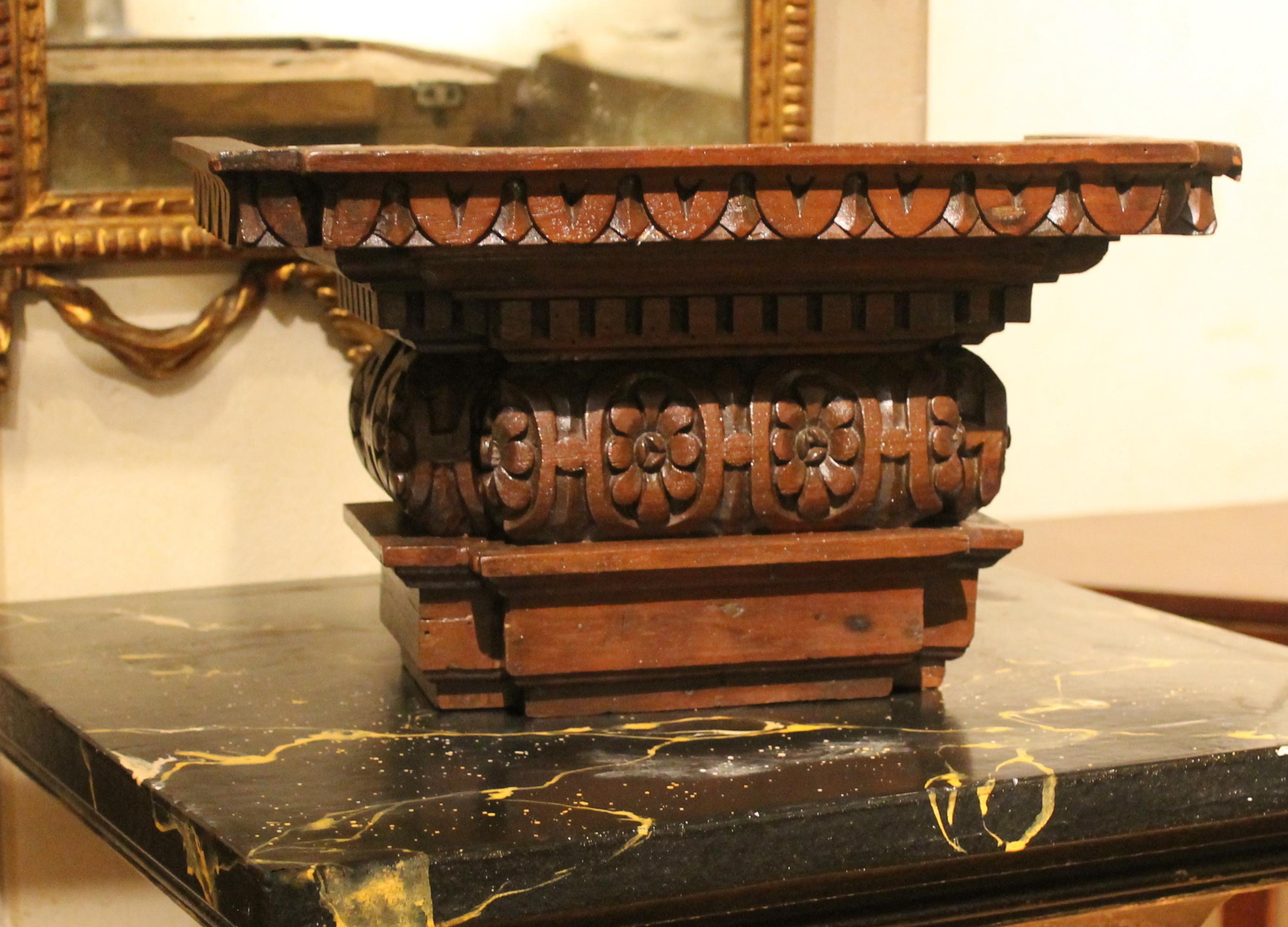 This wonderful antique 19th century Tuscan solid walnut wood wall-mounted shelf is deeply hand carved. An entirely handcrafted neoclassical style wall bracket of narrow proportion with the most wonderful architectural shape and patina.
This charming