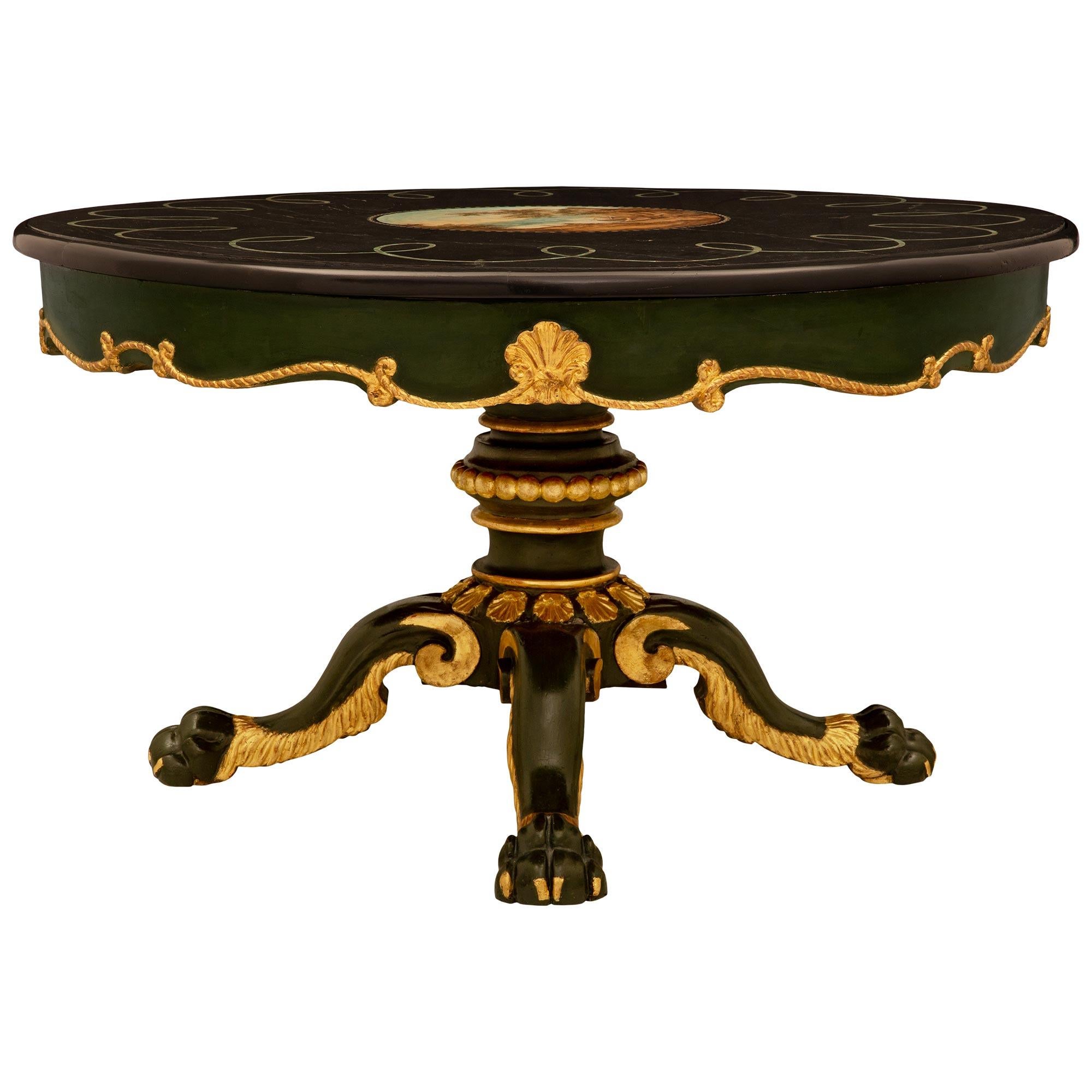 An impressive and large scale Italian 19th century Baroque st. polychrome, giltwood and Scagliola center table. The circular table is raised by elegantly scrolled polychrome legs with handsome paw feet decorated with fine giltwood accents and superb