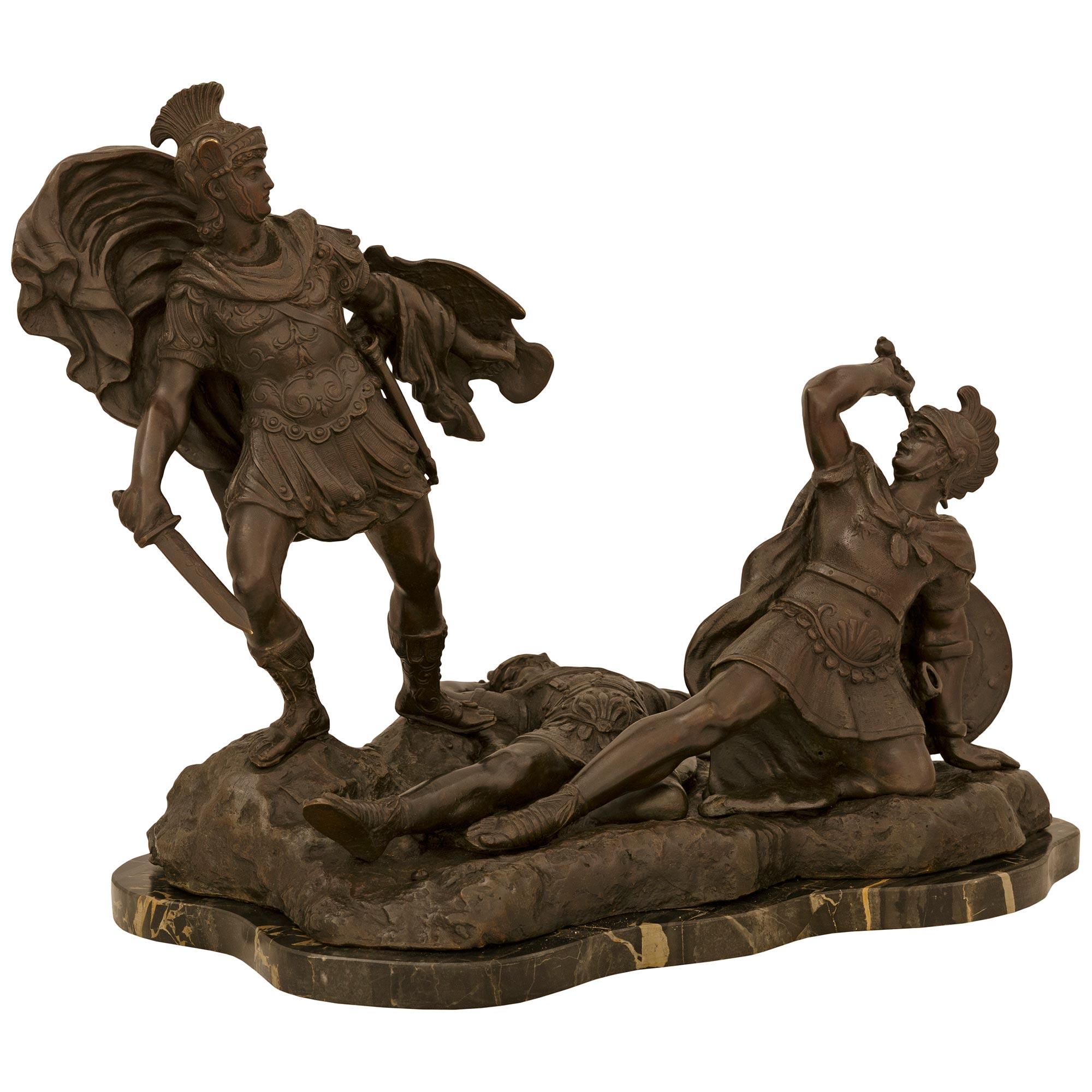 A handsome and high quality Italian 19th century Neo-Classical st. patinated Bronze and Portoro marble statue of Aeneas, Lausus, and Mezentius. This impressive statue is raised on a scalloped Portoro marble base mimicking the shape of the bronze