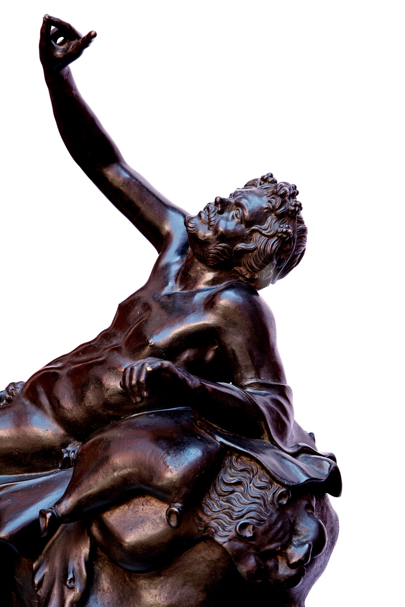 Italian 19th century, after the antique, bronze of Bacchus signed Chuirazzi. Modelled as seated with one raised arm.