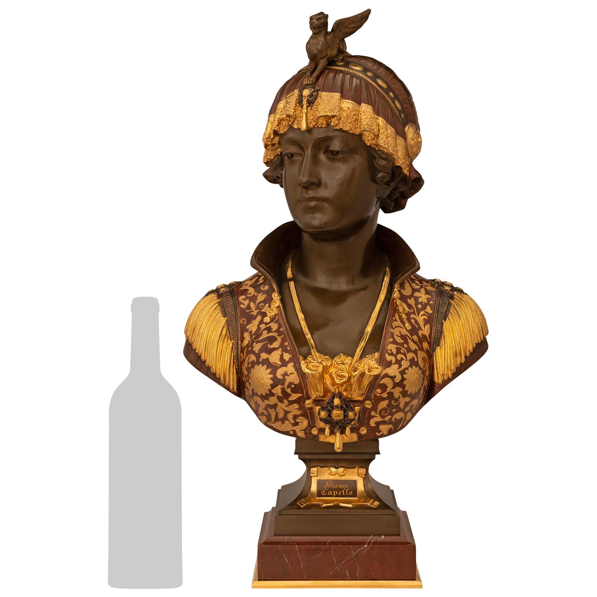 An elegant and high quality Italian 19th century Neo-Greek st. patinated Bronze, Ormolu, and Rouge Griotte marble bust of Bianca Capello signed C. Ceribelli. This very attractive bust of Bianca Capello is raised by a square mottled block of Rouge