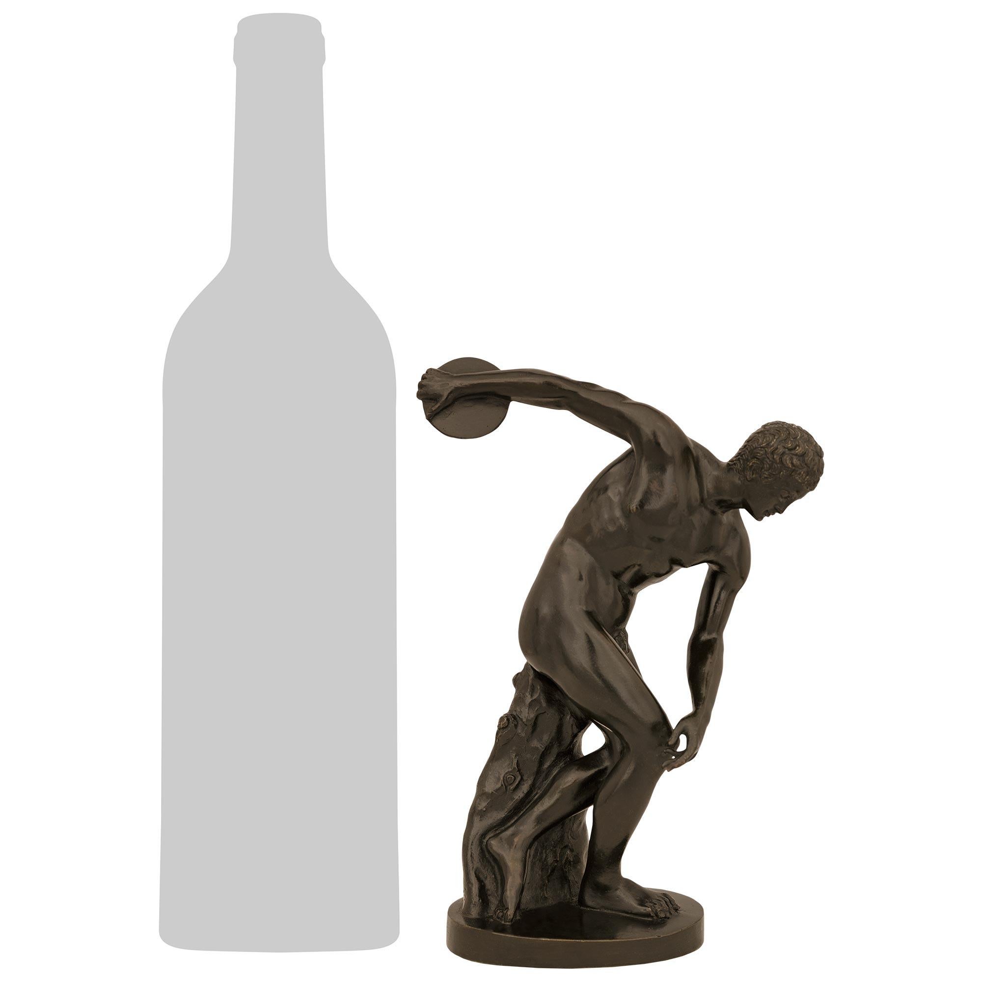 A handsome and high quality Italian 19th century Grand Tour Period patinated Bronze statue of The Discus Thrower, modeled after Myron. The impressively detailed Discobolus, which is based on Myron's statue from 460-440 BC, is raised on an elegant