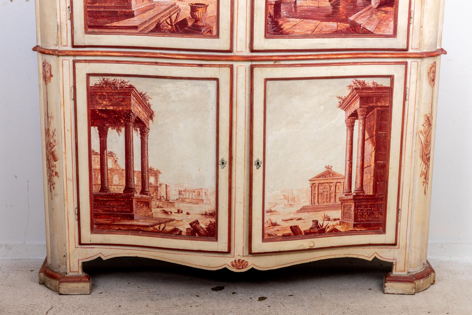 Hand painted 19th century two part Italian cabinet or linen press. The 
case is decorated with scenes of Roman antiquity and classical motifs.
