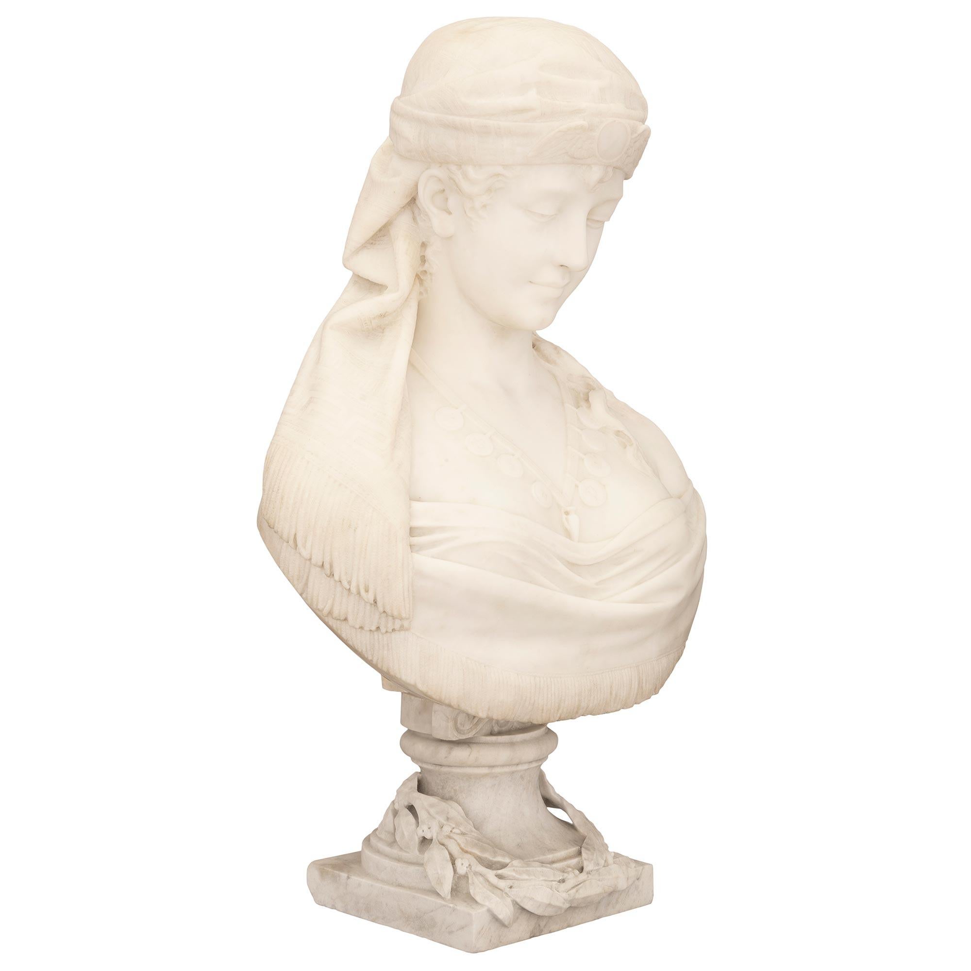 A stunning and extremely high quality Italian 19th century white Carrara marble bust of Cleopatra, signed C. Lapini 1888. This exceptional bust is raised by a square base with an elegant mottled socle shaped support draped with charming finely