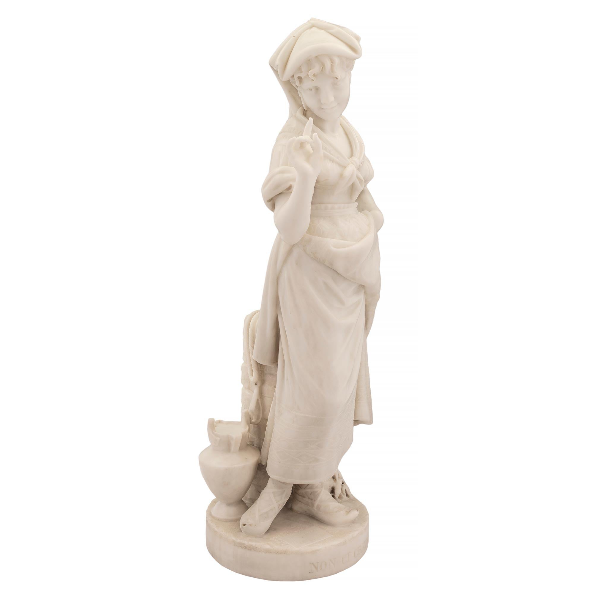 A charming and high quality Italian 19th century white Carrara marble statue of a young girl, titled NON CI CREDO, signed C. LAPINI FIRENZE 1887. The statue is raised by a circular base where the title is etched. The beautiful girl wears finely