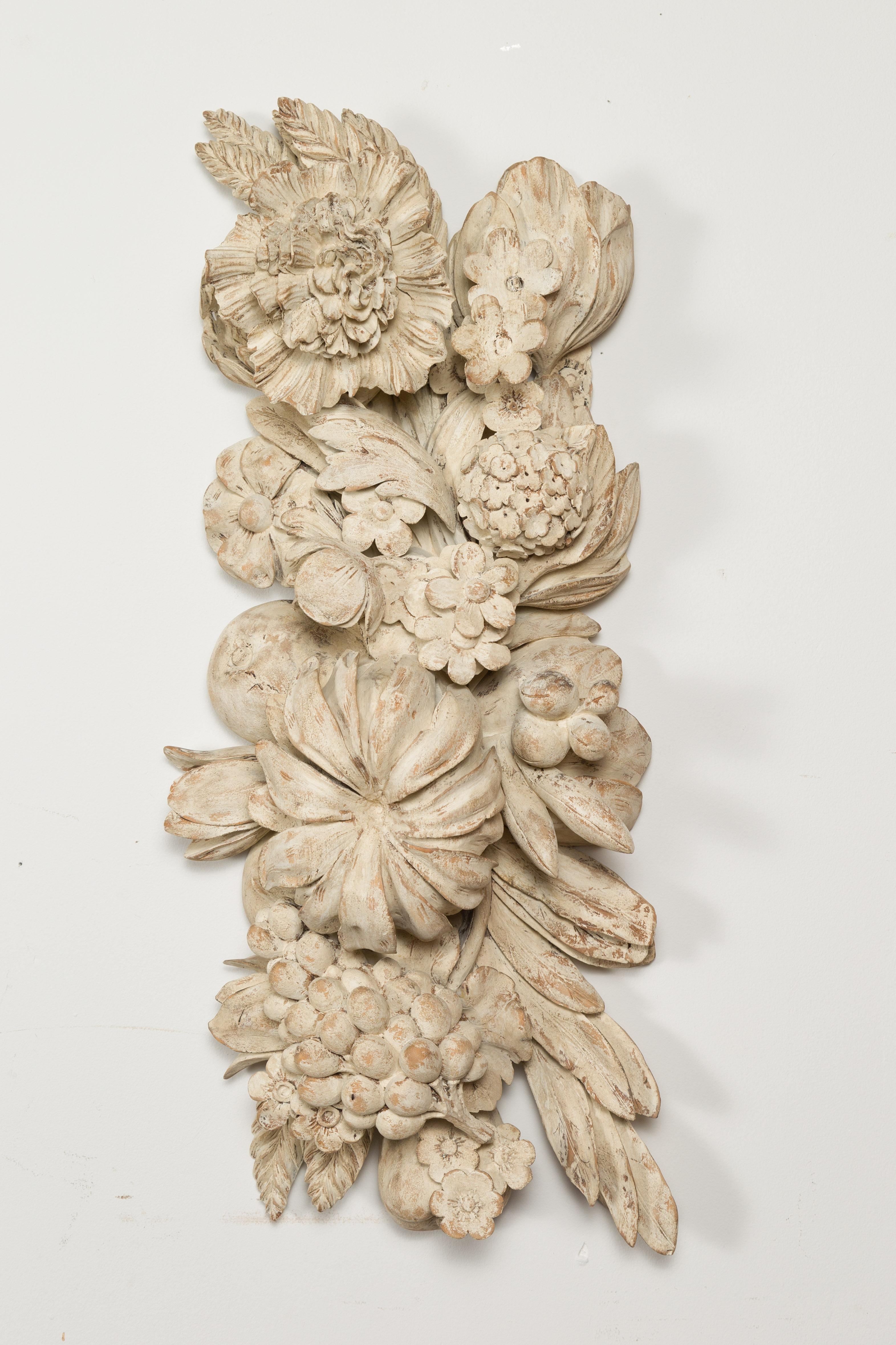 An Italian carved wooden fragment from the 19th century, depicting large fruits and flowers. Created in Italy during the 19th century, this wall fragment features large flowers and fruits on foliage arranged in a joyous composition. Accented with a