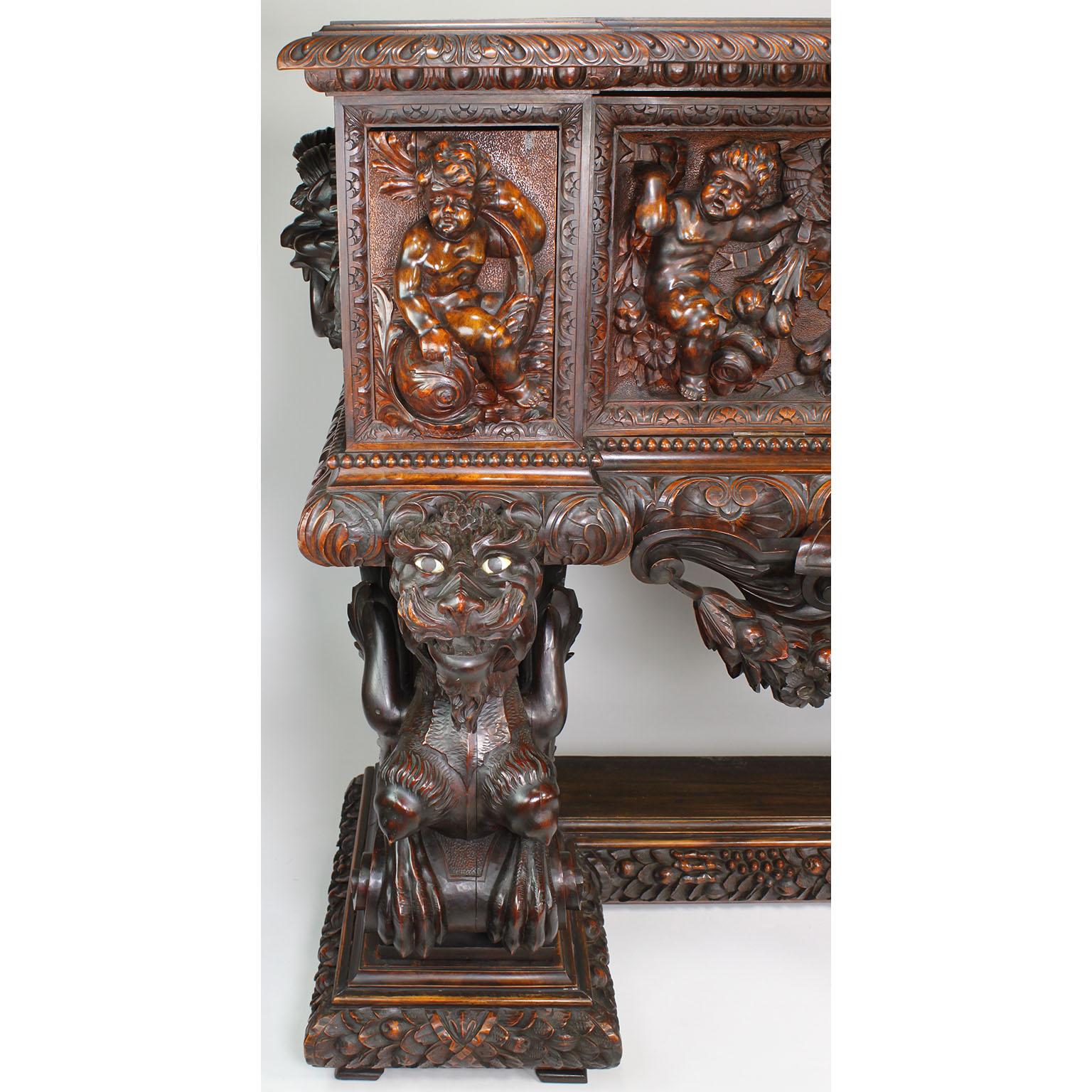 Hand-Carved Italian 19th Century Carved Walnut Cassone Chest with Putti and Winged Dragons For Sale