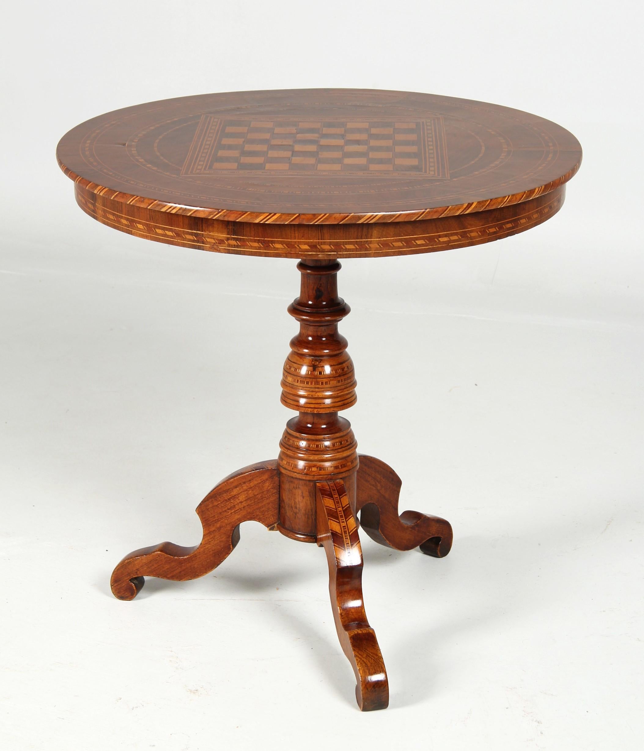 Antique chess table

Italy (Sorrento)
Nussbaum et al.
second half of the 19th century

Dimensions:
H x D: 73 cm x 74 cm

Description:
A very richly inlaid and marquetry piece of furniture.
Trefoil base. Curved legs with so-called leg-shoulder