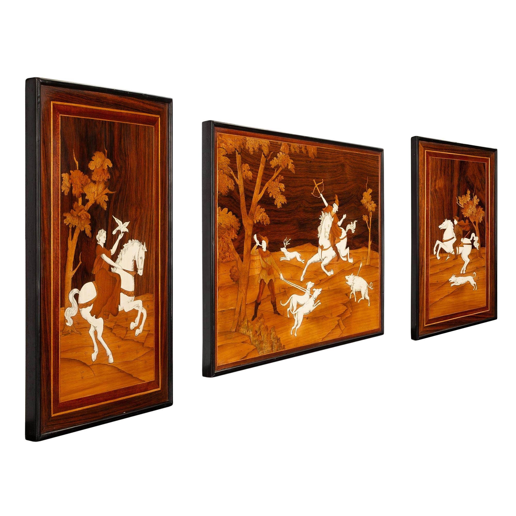 A charming and wonderfully executed complete set of three Italian 19th century bone, ebonized fruitwood, walnut and rosewood decorative marquetry wall panels. Each rectangular panel displays an ebonized fruit wood mottled border and beautiful