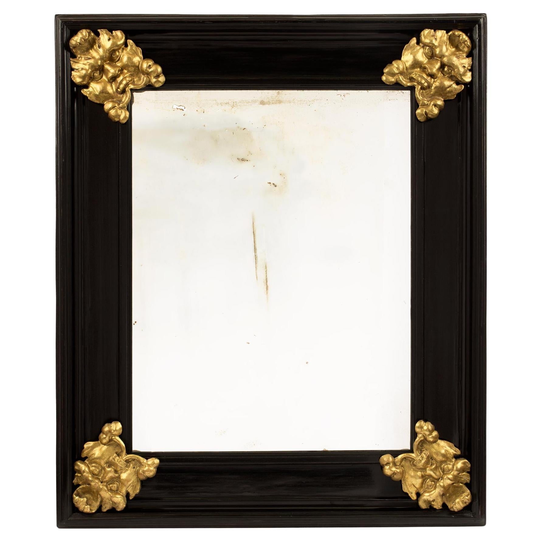 Miroir italien du 19ème siècle en ébène florentin et bois doré
