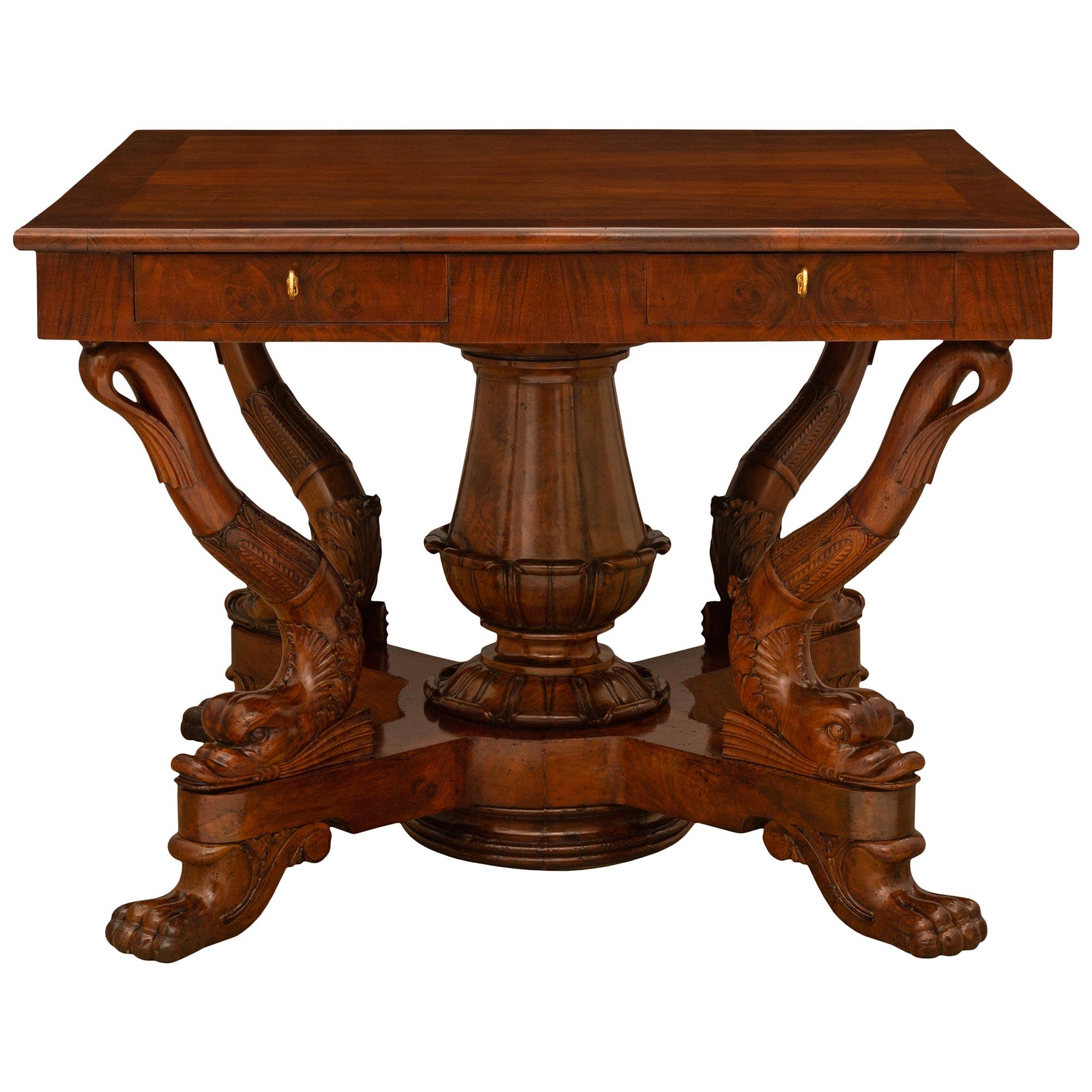 A sensational and unique Italian 19th century Genovese st. Charles X Period Walnut center/dining table. The table displays a circular top, that is removable to showcase a stunning square top below with four drawers. The table is raised by 'C'