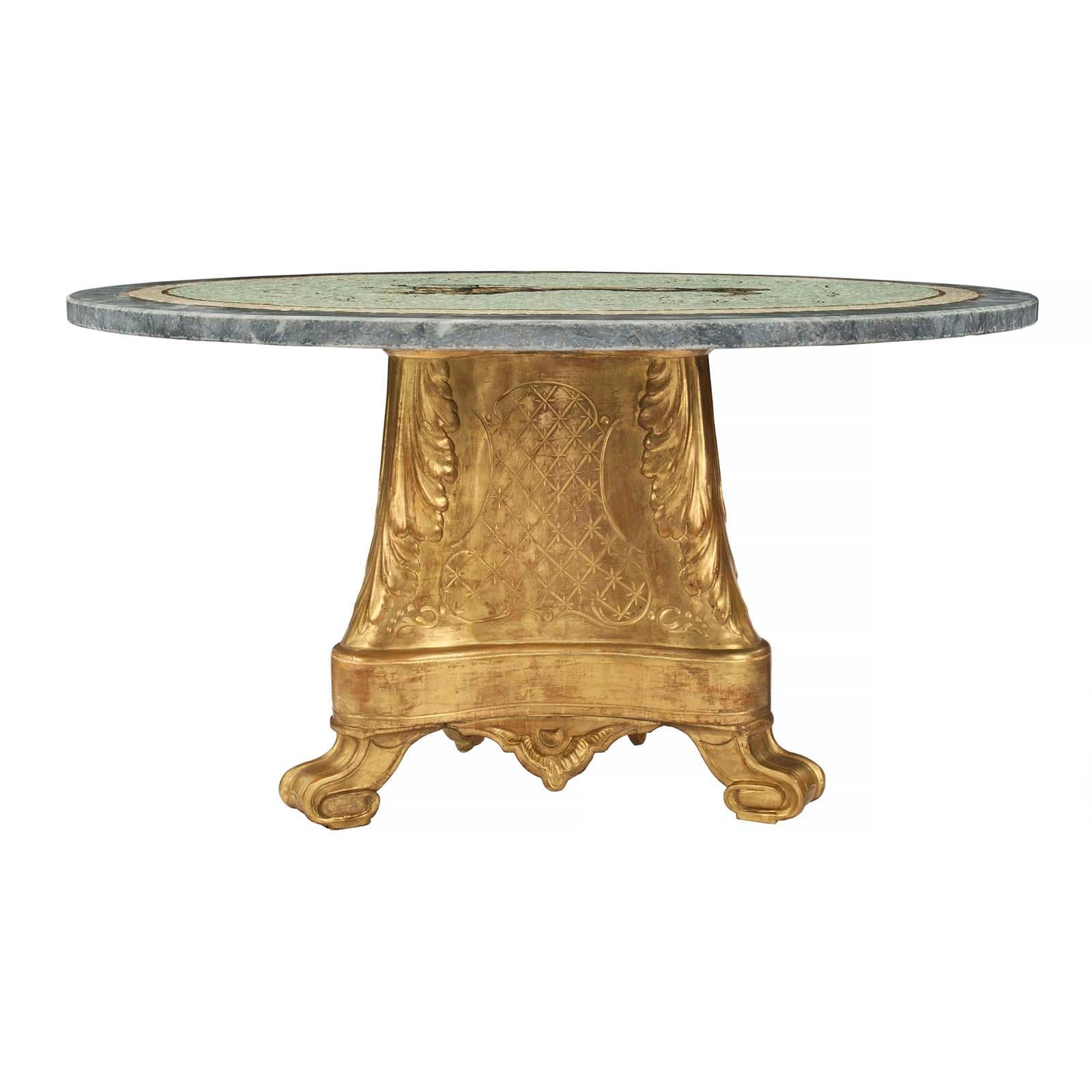 A striking Italian 19th century giltwood, marble and mosaic circular coffee table. The table is raised by a triangular giltwood base with elegantly scrolled feet, concave sides decorated with etched star lattice designs and large acanthus leaves.