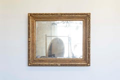 Specchio italiano del XIX secolo in legno dorato con fogliame intagliato e Rais-de-Cœur