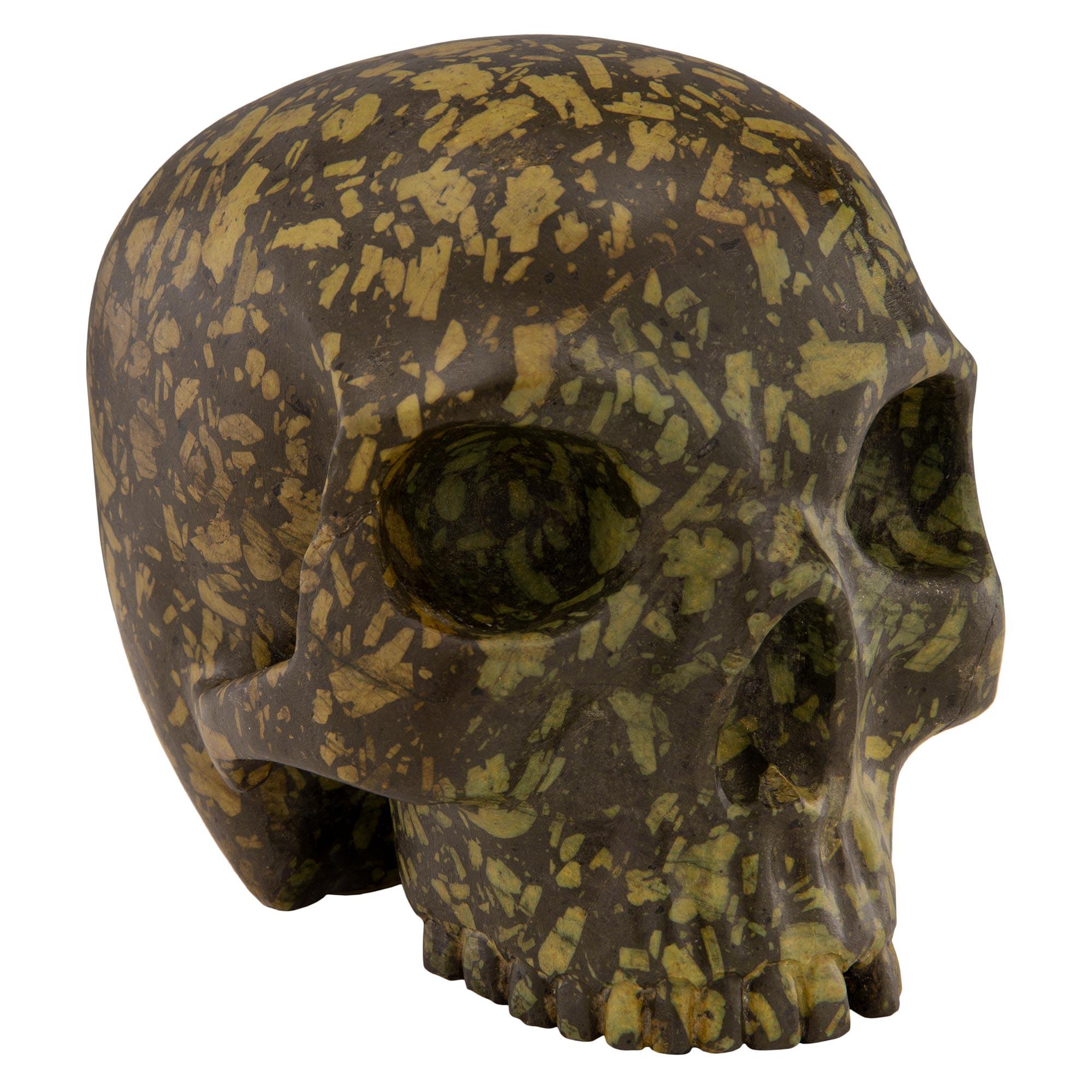 A rare and impressive Italian 19th century green Porphyry skull statue/paperweight. The bold skull displays finely sculpted details which emphasize the exceptional Porphyry marble.

  