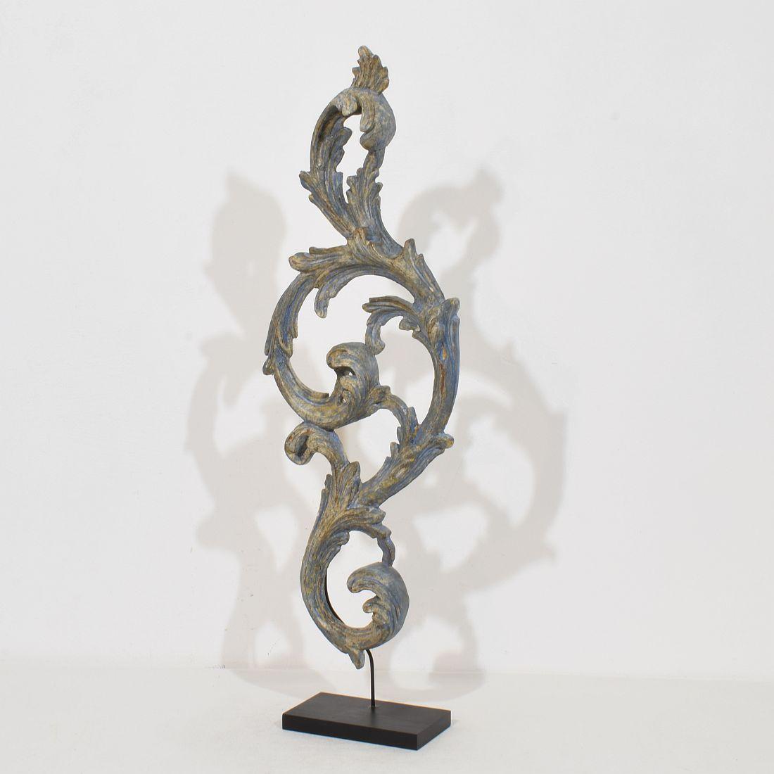 Beautiful handcarved baroque style ornament that once adorned a chapel or a church with a stunning blue color.
Italy, circa 1850. Weathered. Measurement includes the wooden base.
H:72cm  W:24cm D:9cm 