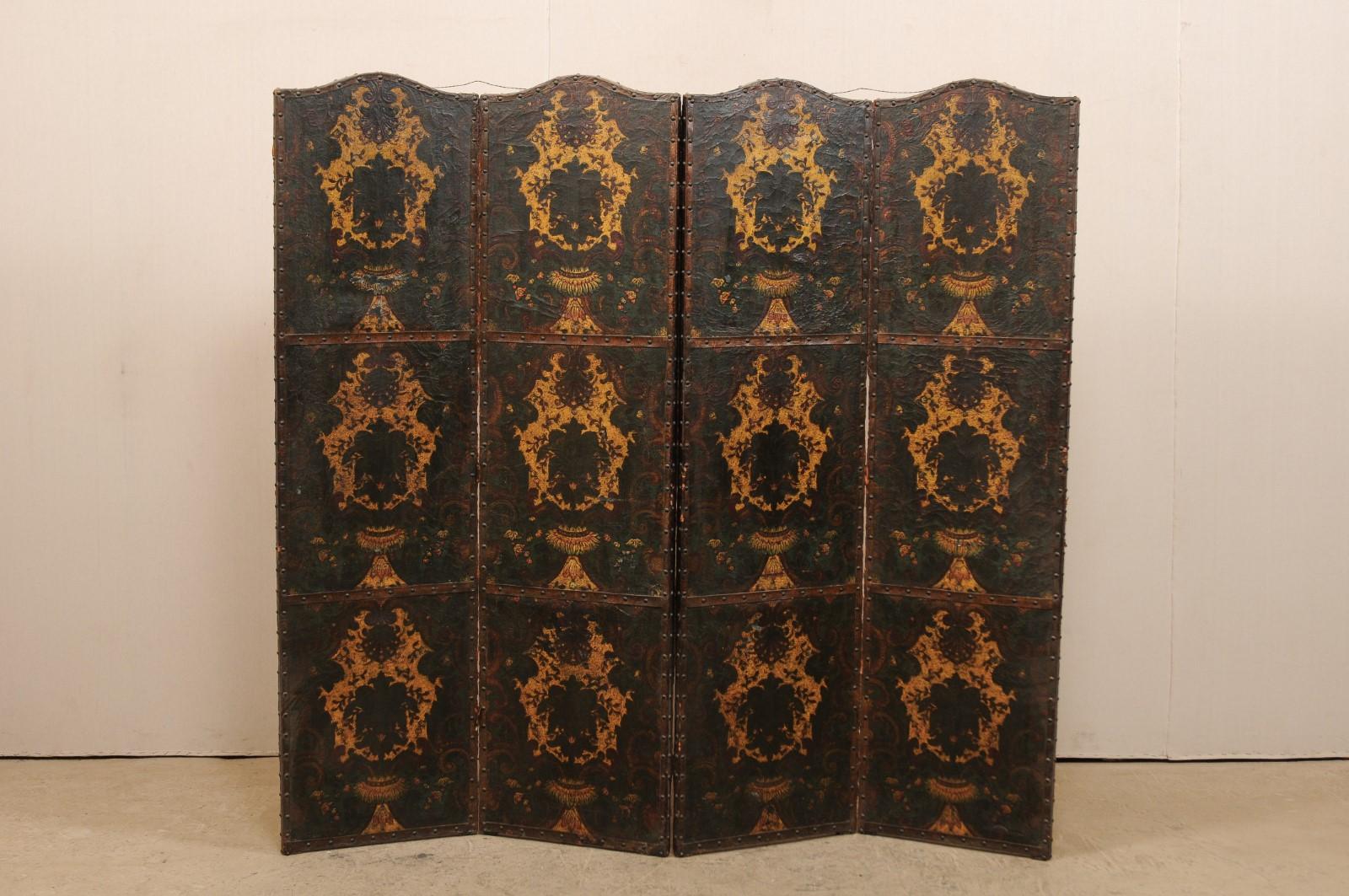 An Italian hand painted leather room divider from the 19th century. This antique accordion style folding screen from Italy features 4 connected panels, each with an arch-shaped top, whose front sides are adorn in leather with original hand painted