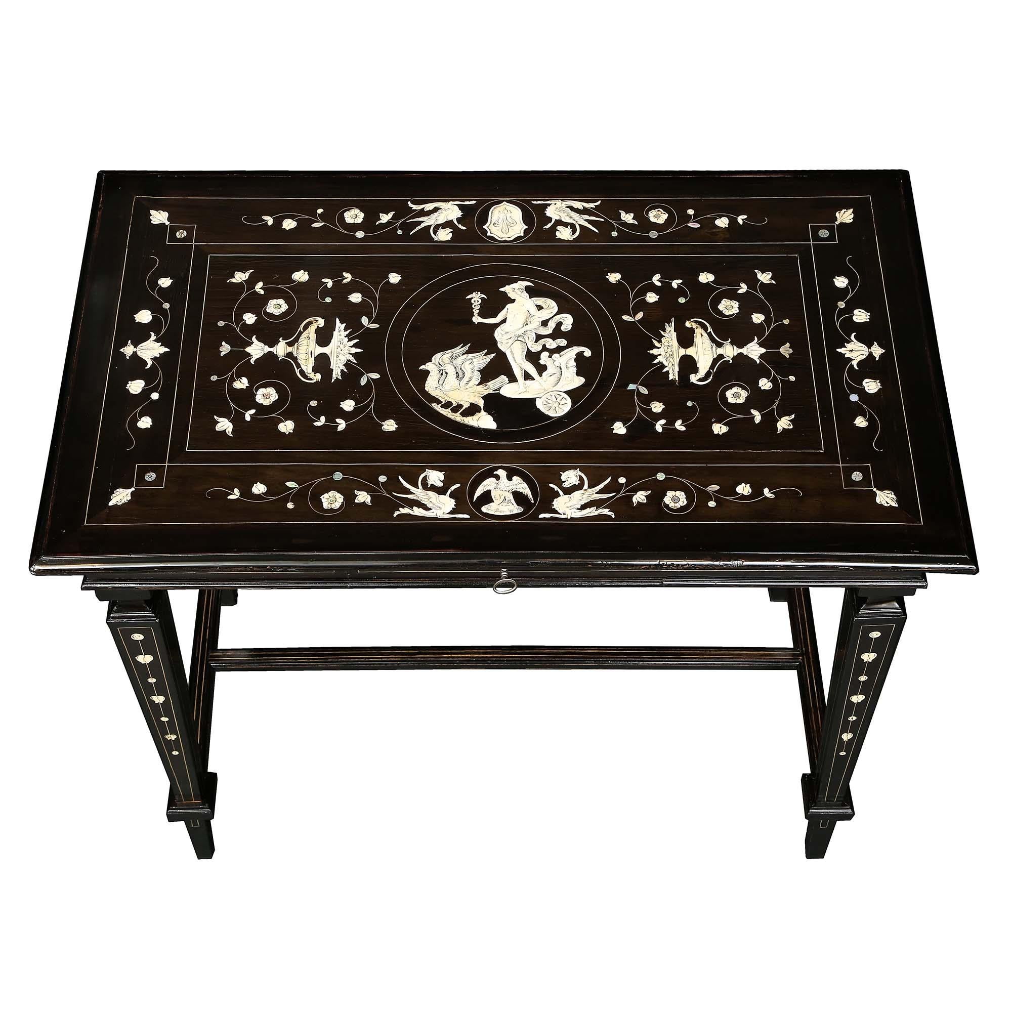 A striking Italian early 19th century Louis XIV style ebony table. The table is raised by tapered legs joined by an H stretcher. The glorious table top is inlayed with bone and mother of pearl bringing together the remarkable, yet restrained, flower