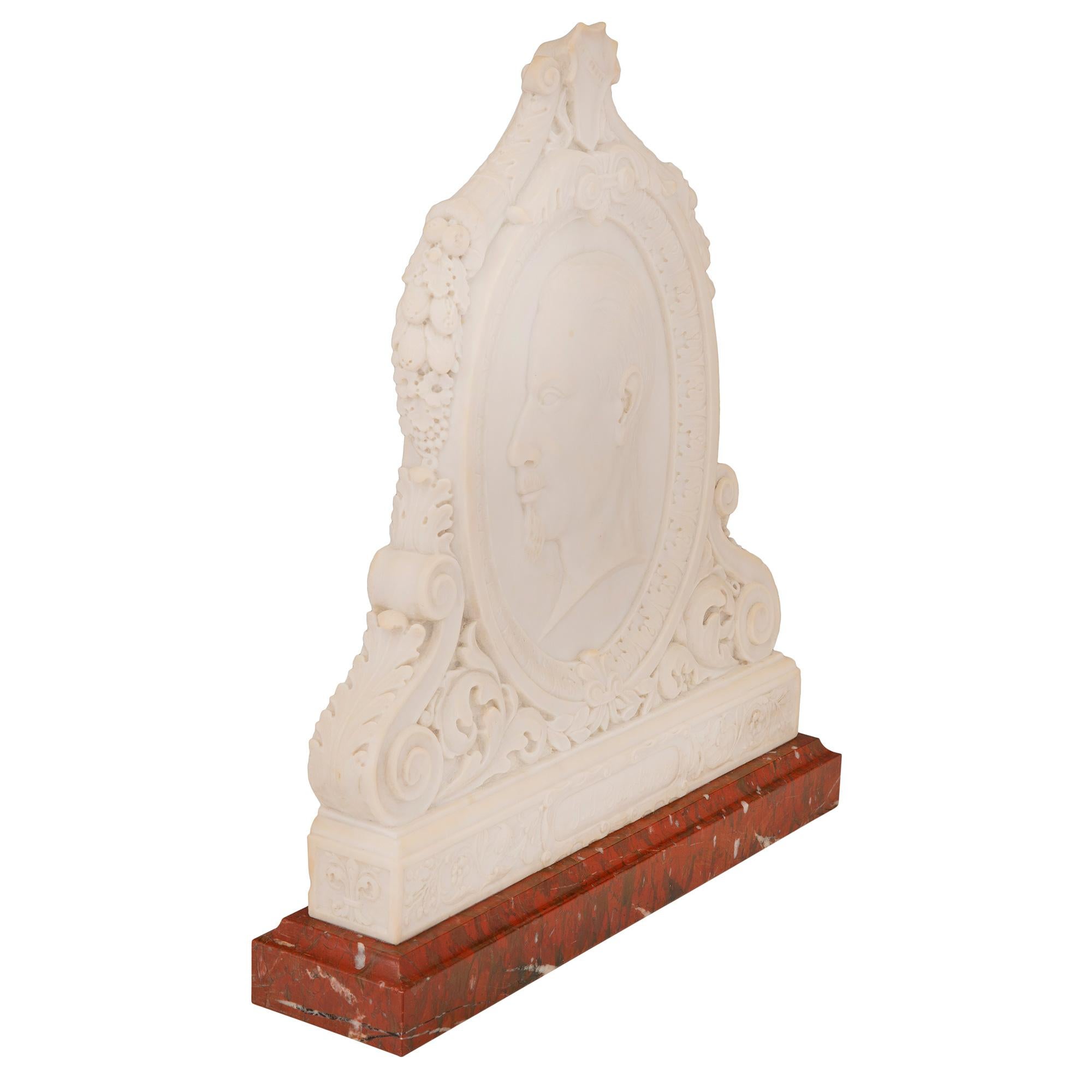 A beautiful and extremely high quality Italian 19th century Louis XVI St. white Carrara and Rouge Griotte marble freestanding plaque of Joseph Carlino, sculpted by Remo Liverzani. The most decorative plaque is raised by a beautiful Rouge Griotte