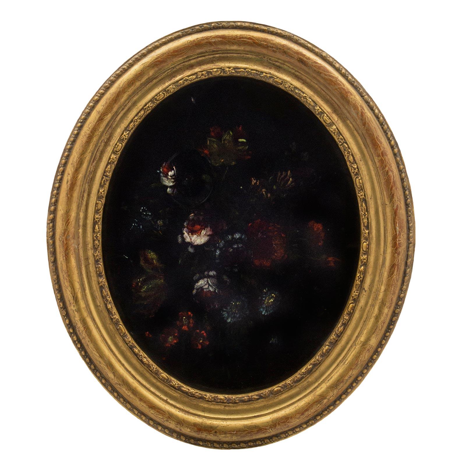 A wonderful pair of decorative Italian 19th century Louis XVI st. oval reverse painted on glass still lifes. The pair are framed within giltwood frames with a mottled floral etched design with an outer and inner beaded trim. Each still life is a