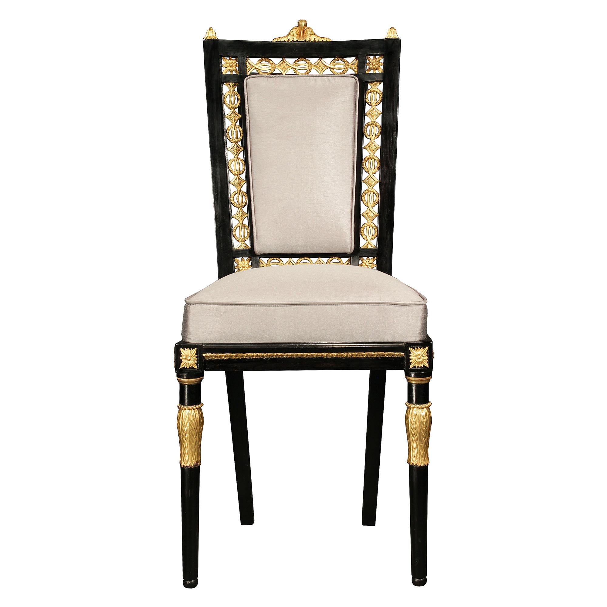Italian 19th Century Louis XVI Style Set of Sixteen Ebony and Giltwood Chairs In Good Condition For Sale In West Palm Beach, FL
