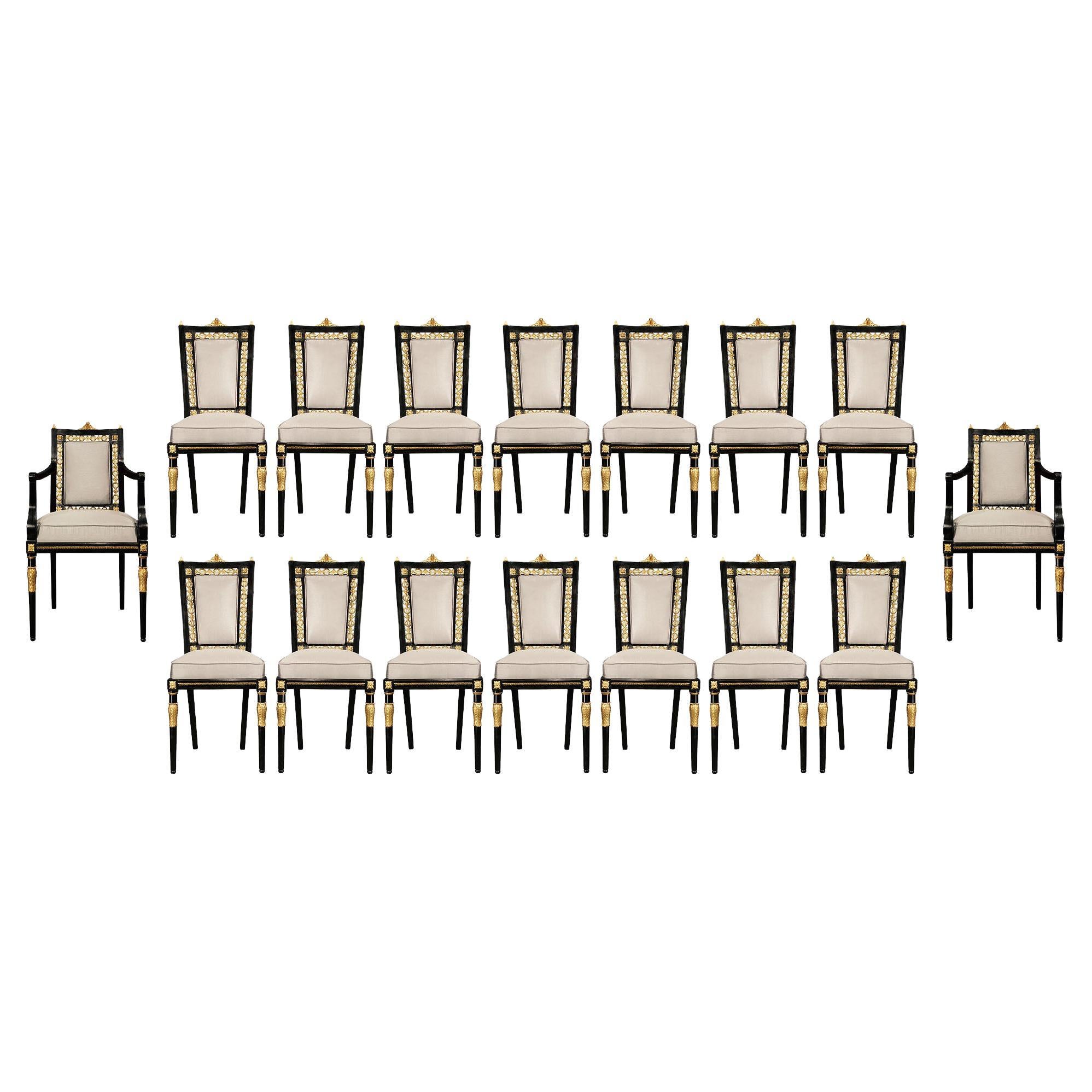 Italian 19th Century Louis XVI Style Set of Sixteen Ebony and Giltwood Chairs