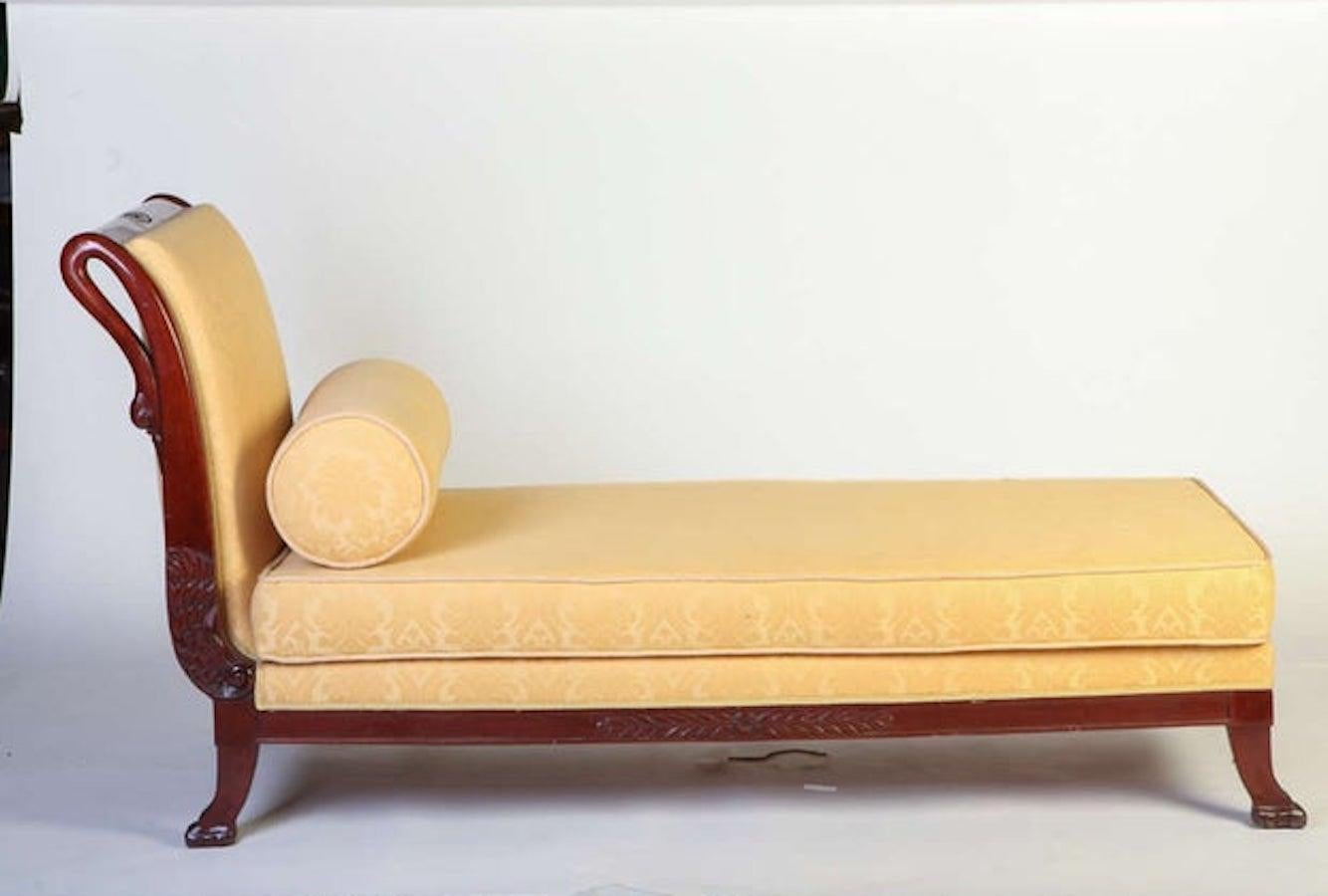 A fine tuscany mahogany swan neck sofa
The front side of the curved arm ends on carved swan, The settee rests on four lion paw feet.
 Upholstery in a very good condition.
