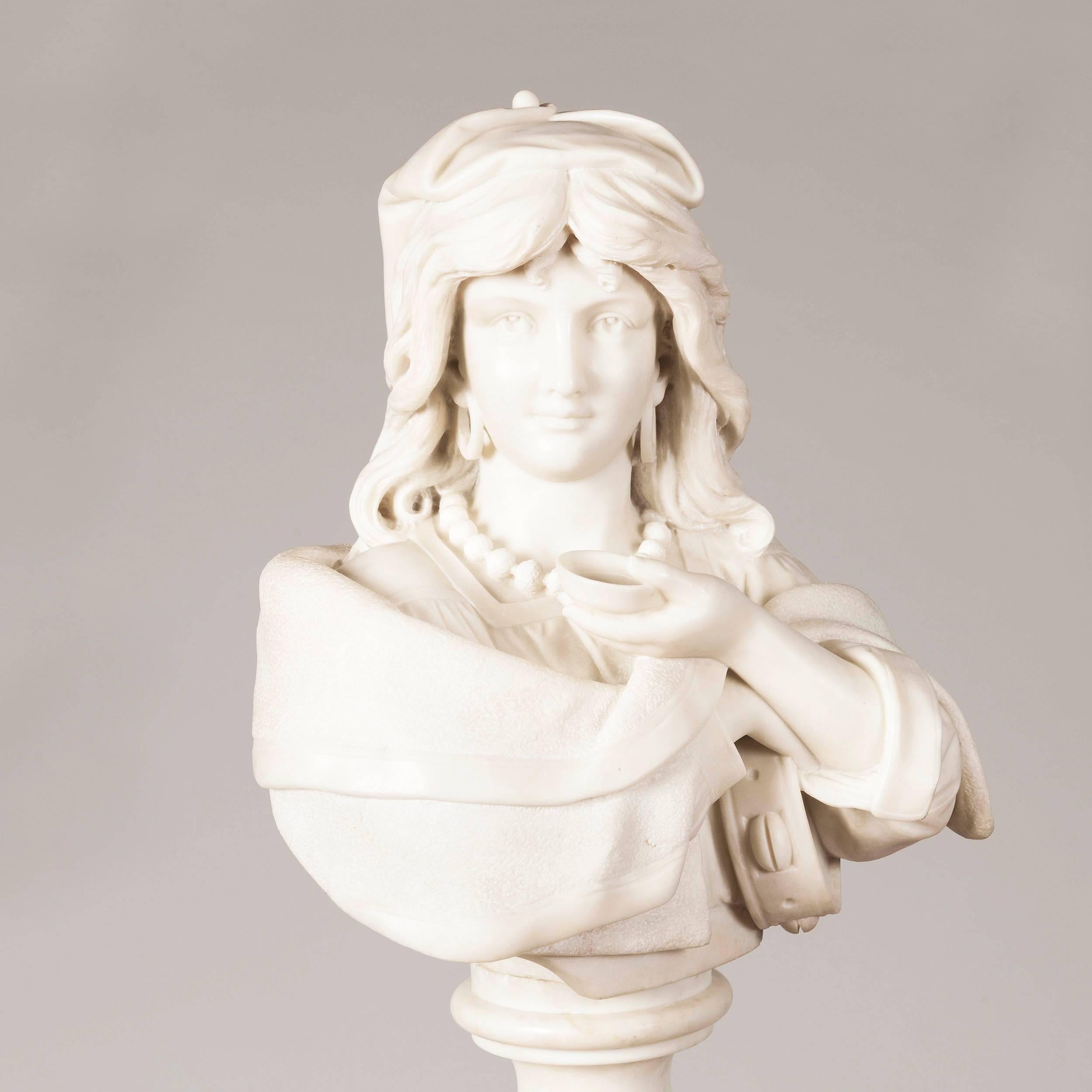 Signed by the sculptor 'Ruffini'

The bust of the coquettish smiling maiden, dressed in a mob cap, her bead necklet wearing hooped earrings, and holding her tambourine, is carved from white Carrara marble, and sits upon a circular turned and