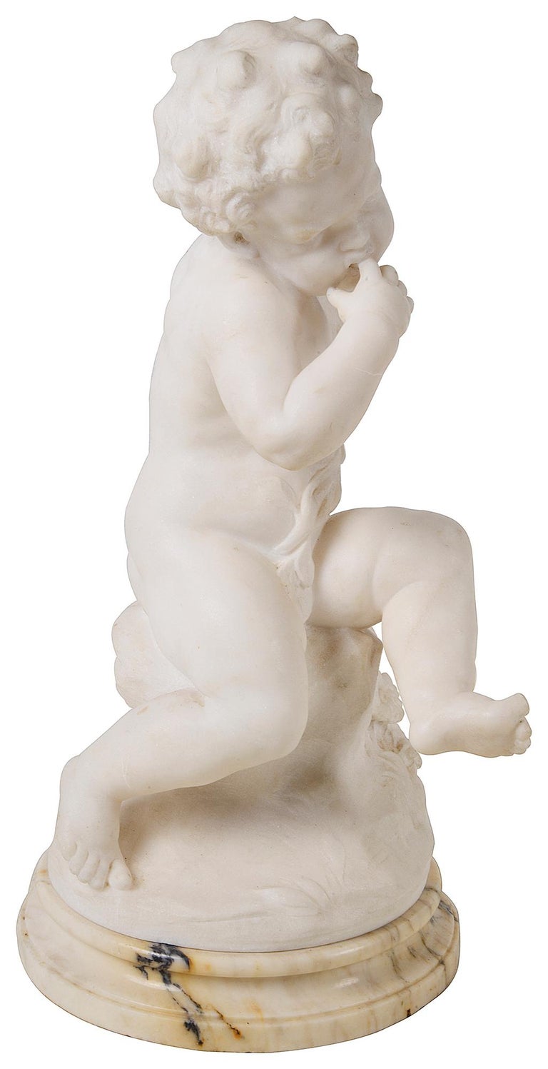 An enchanting 19th Century Italian carved marble statue of a young child sitting on a rock holding a bunch of flowers.
Indescript signature.