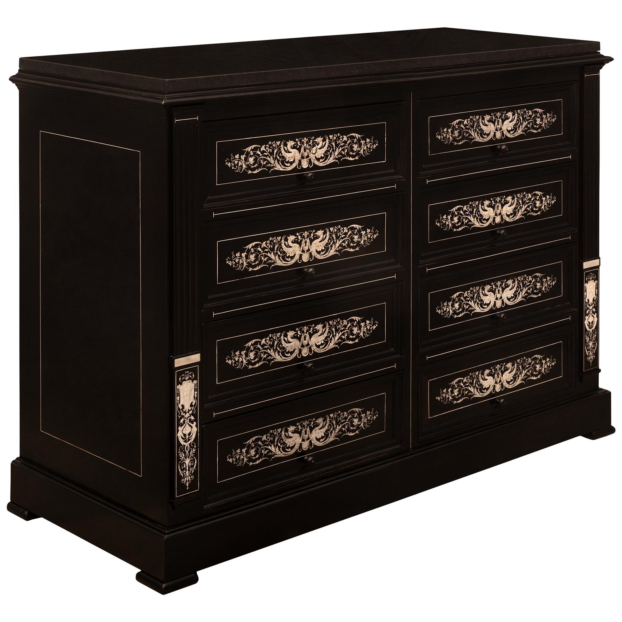 A high quality and very attractive Italian 19th century Milanese st. Ebony and bone commode. The eight drawer commode is raised by a straight frieze above a bull nose support flanked by fluted columns with lower bone inlays of winged birds over