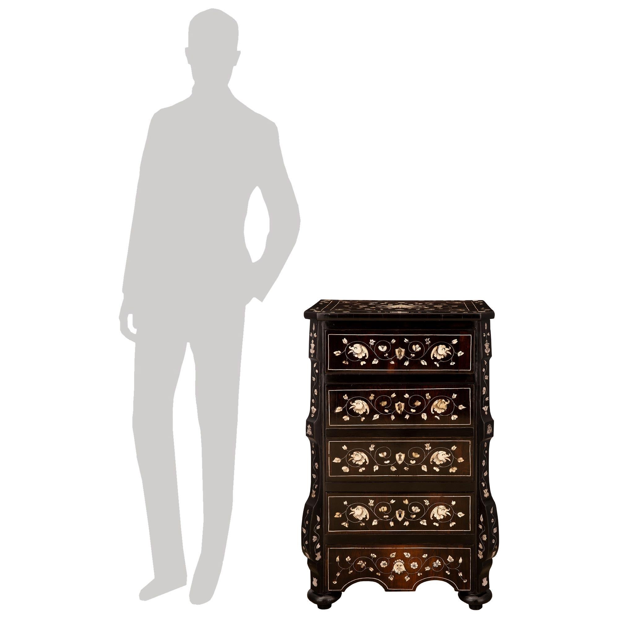 A charming Italian 19th century Milanese st. Rosewood, Ebonized Fruitwood and Bone chiffonier cabinet, stamped Brevete VF Paris. The three drawer, one door chiffonier is raised by four topie shaped bun feet below the scalloped shaped apron. Most