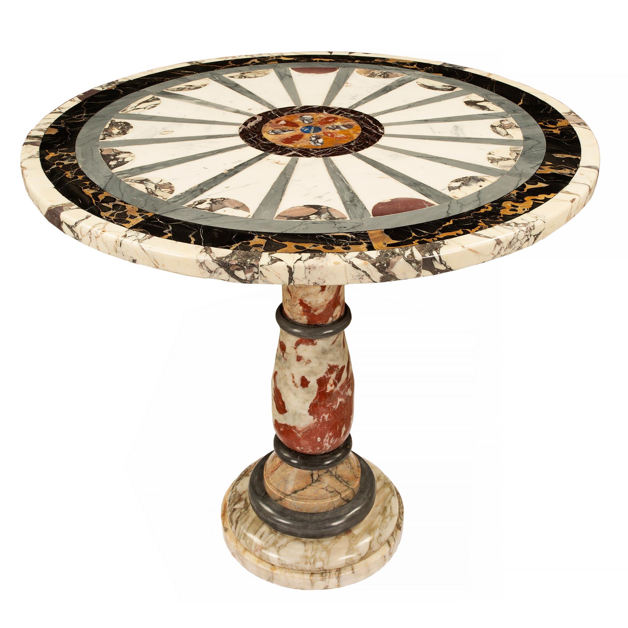 A magnificent Italian 19th century Neo-Classical st. marble side/center table. The table is raised by a circular mottled Breche Violette base below an elegant Bleu Turquin marble band and the circular Incarna Turquin central support. The stunning