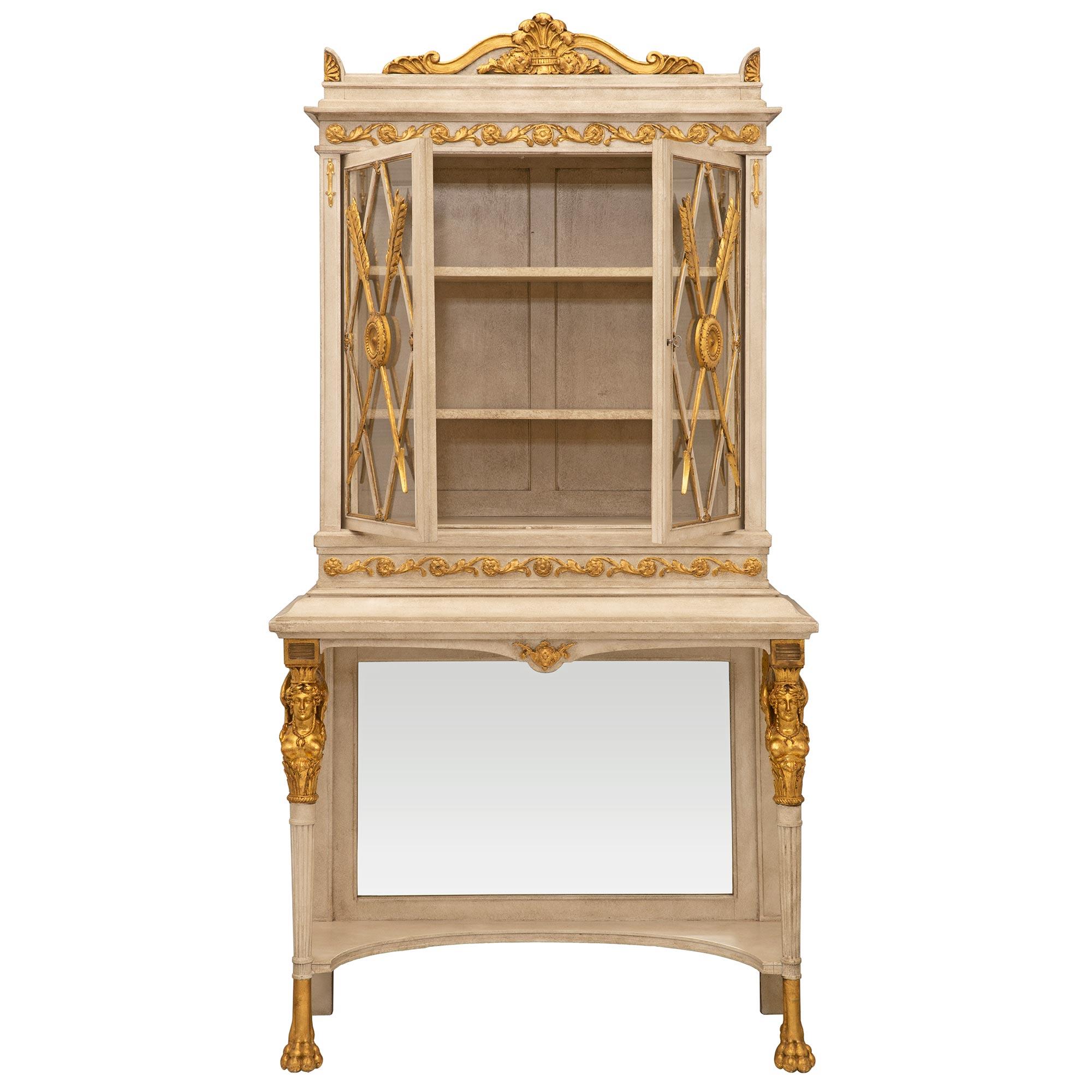 A beautiful and most elegant Italian 19th century Neo-Classical st. patinated and giltwood cabinet vitrine. The vitrine is raised by circular tapered fluted legs with handsome giltwood paw feet, striking richly carved winged caryatids with crowns,