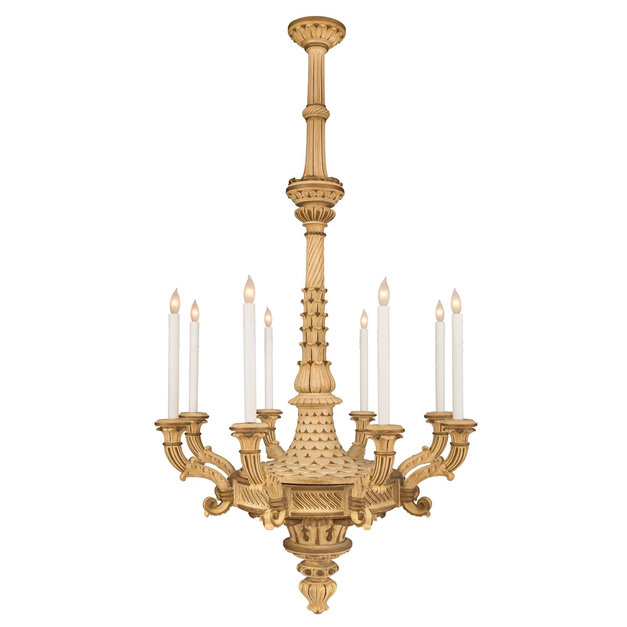 A wonderful and most unique Italian 19th century Neo-Classical patinated eight arm chandelier. The chandelier is centered by a lovely foliate bottom inverted finial below striking Les Oves and acanthus leaf movements. Each elegantly scrolled arm