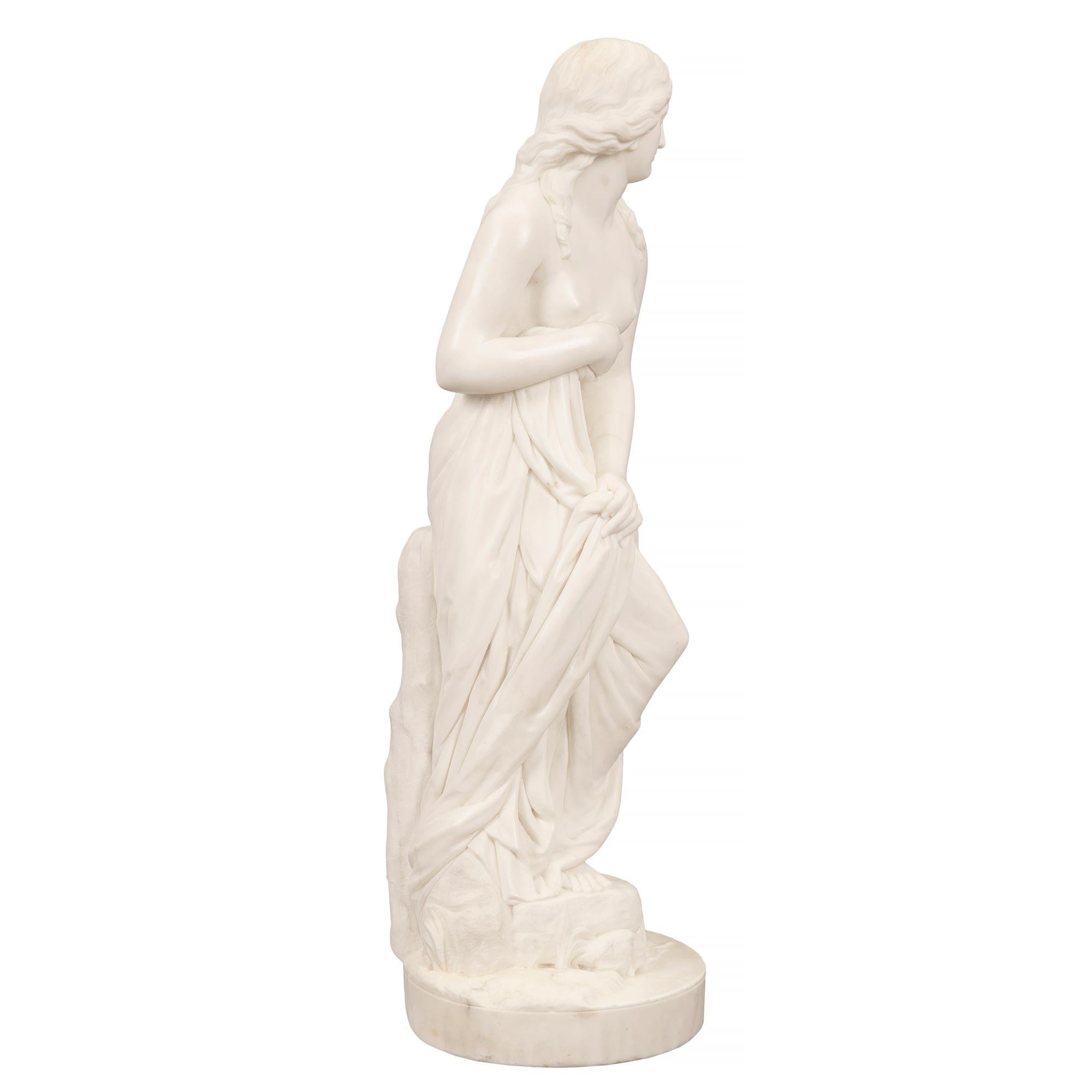 A lovely and finely sculpted Italian 19th century Neo-Classical st. white Carrara marble statue of 