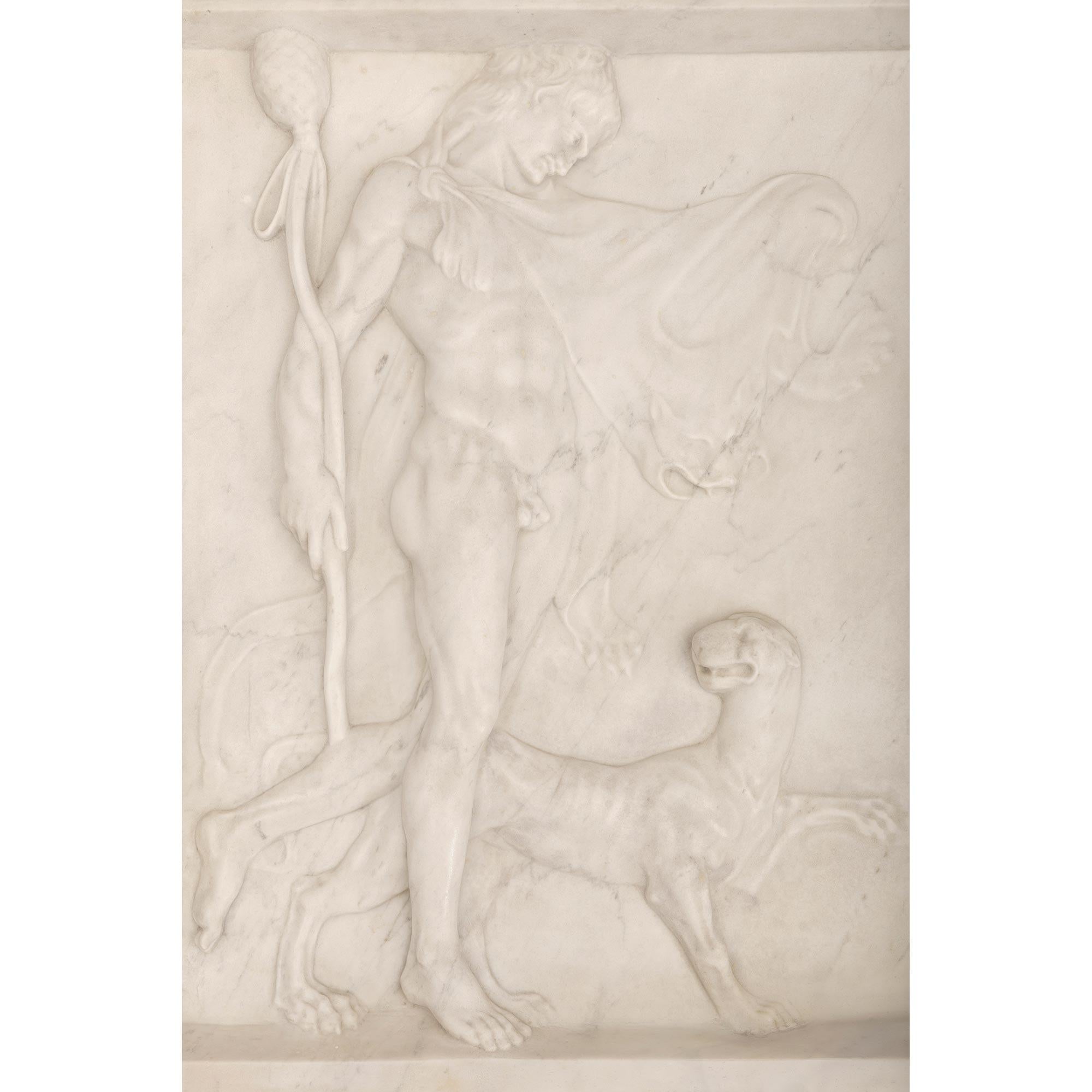 A stunning and most impressive Italian 19th century neo-classical st. White Carrara marble wall decor relief plaque. The rectangular plaque displays an elegant raised lip at the top and bottom framing the beautiful intricately detailed scene at the