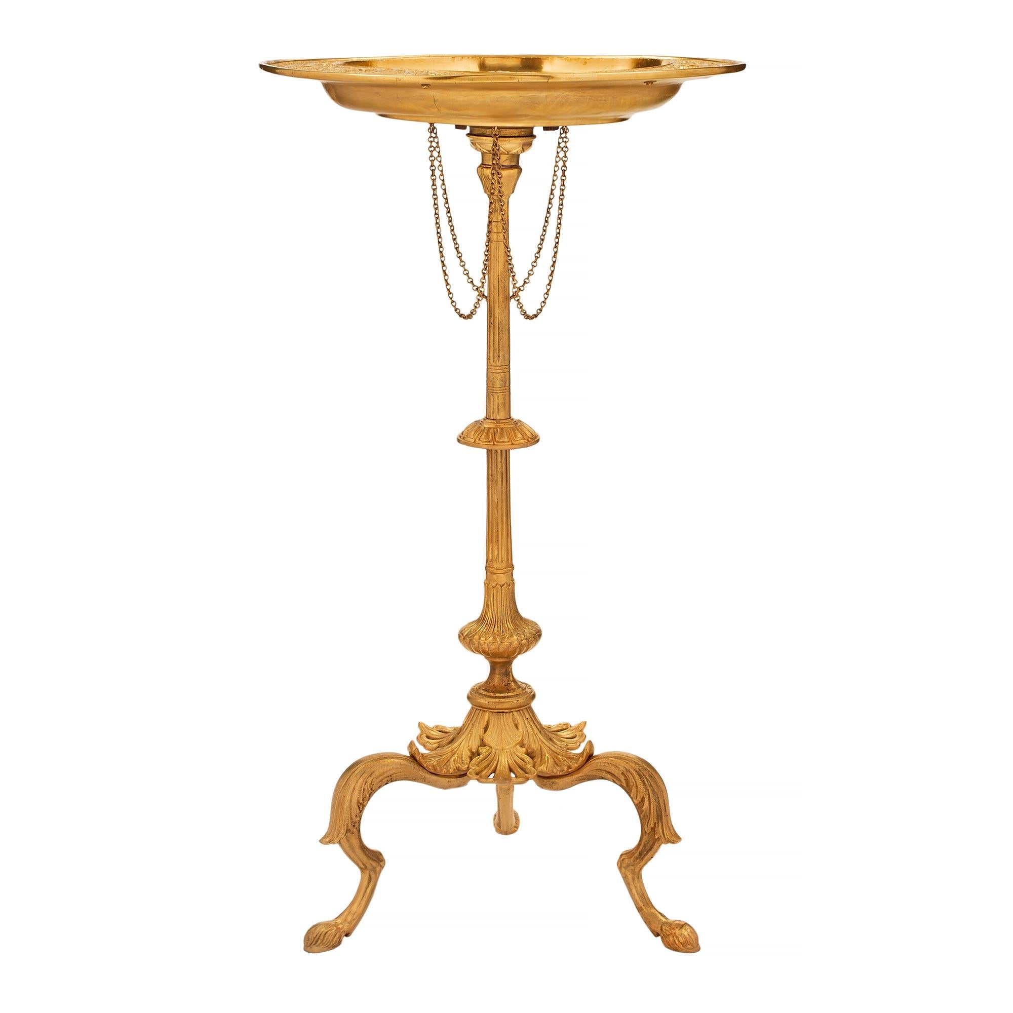 A most decorative Italian 19th century neo-classical st. ormolu side table, after a model by François Briot's, Temperantia, Temperance Dish. The table is raised by three scrolled supports with beautiful hoof feet and foliate designs. The central