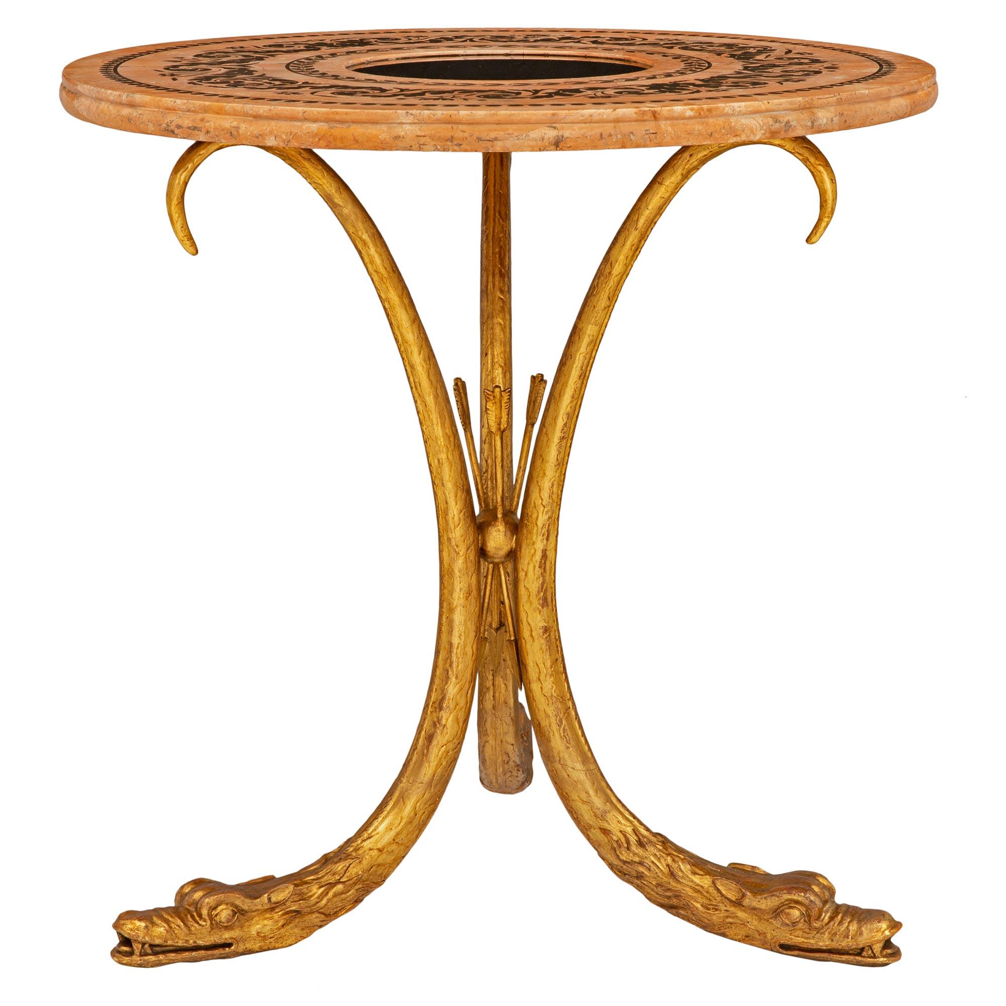 A striking and most unique Italian 19th century Neo-Classical st. giltwood, scagliola and cobalt blue glass center table. The table is raised by three elegant lightly curved supports of impressive and richly carved snakes with fine attention to