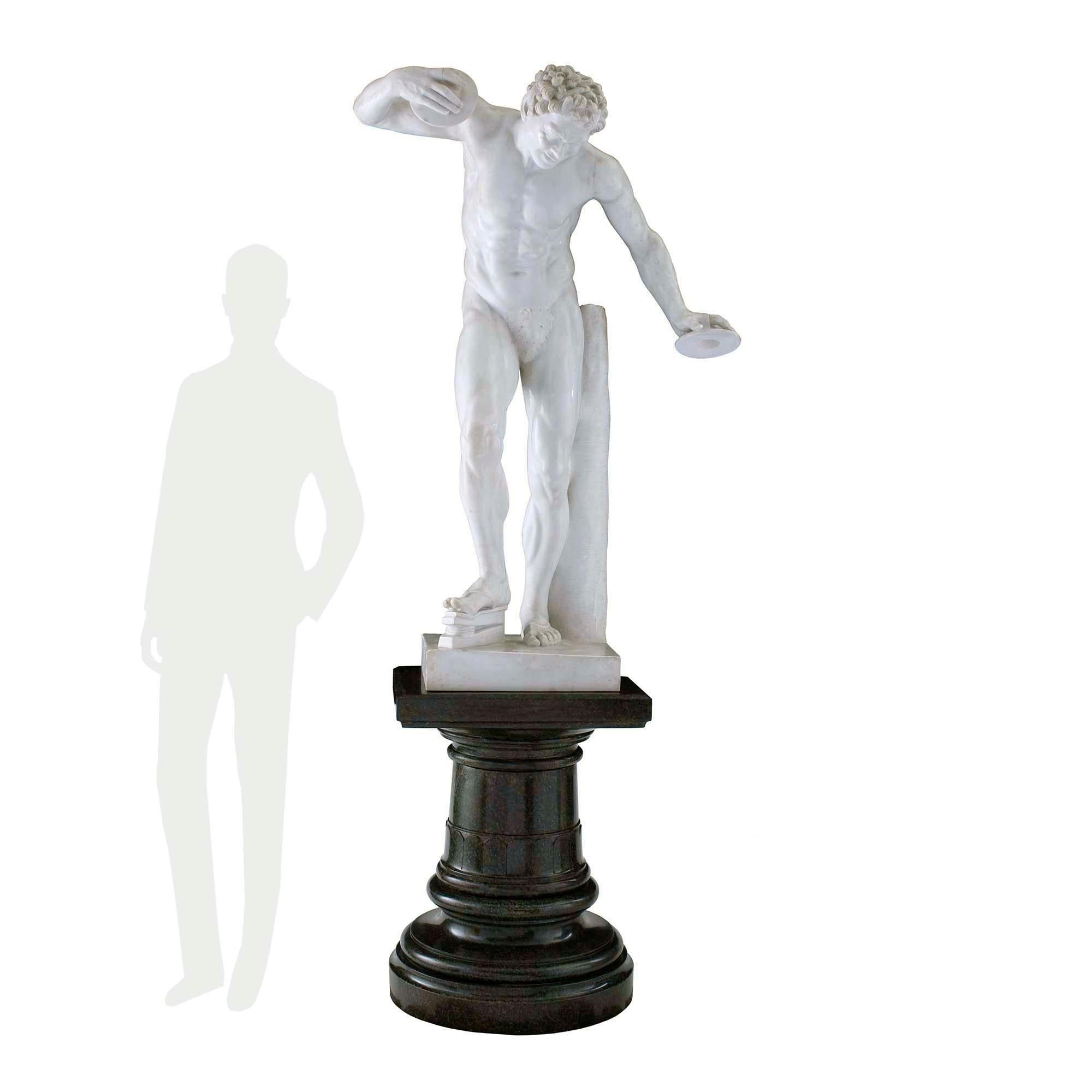 A sensational and large-scale Italian 19th century Neo-Classical st. white Carrara marble statue of a faun with cymbals signed Bazzanti, Firenze. The striking statue is raised by its original Vert Maurin marble pedestal with a mottled circular base,