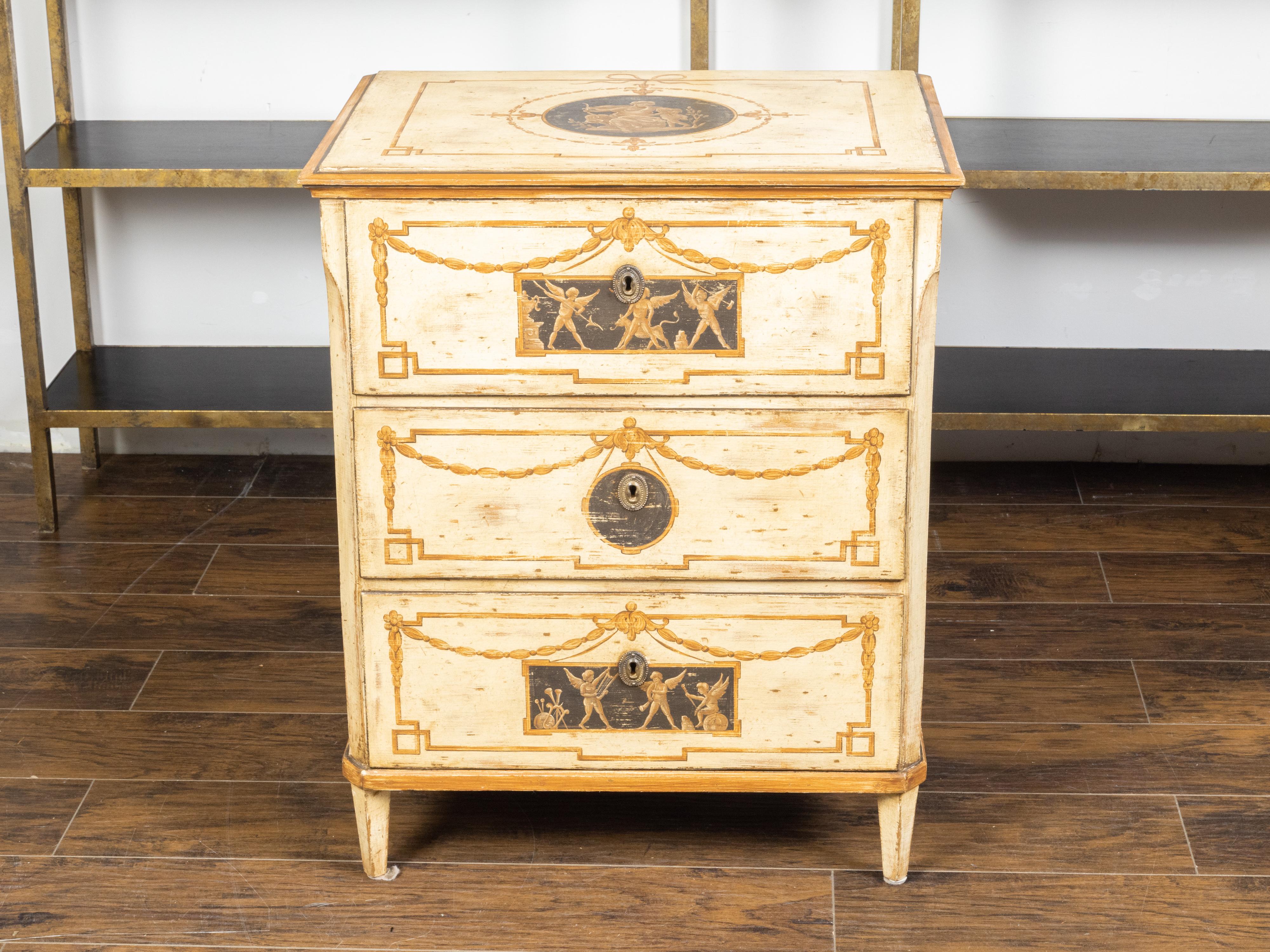 An Italian neoclassical style painted wood three drawer commode from the 19th century, with mythological scenes. Created in Italy during the 19th century, this neoclassical commode draws our attention with its nicely weathered painted finish