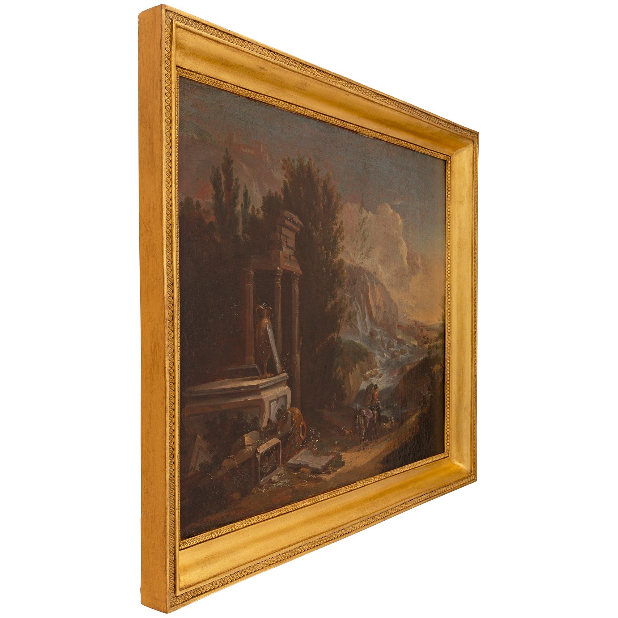 Superbe huile sur toile italienne du XIXe siècle dans son cadre d'origine en bois doré. Cette peinture merveilleusement exécutée représente une magnifique campagne italienne au coucher du soleil, avec des montagnes en arrière-plan, une magnifique